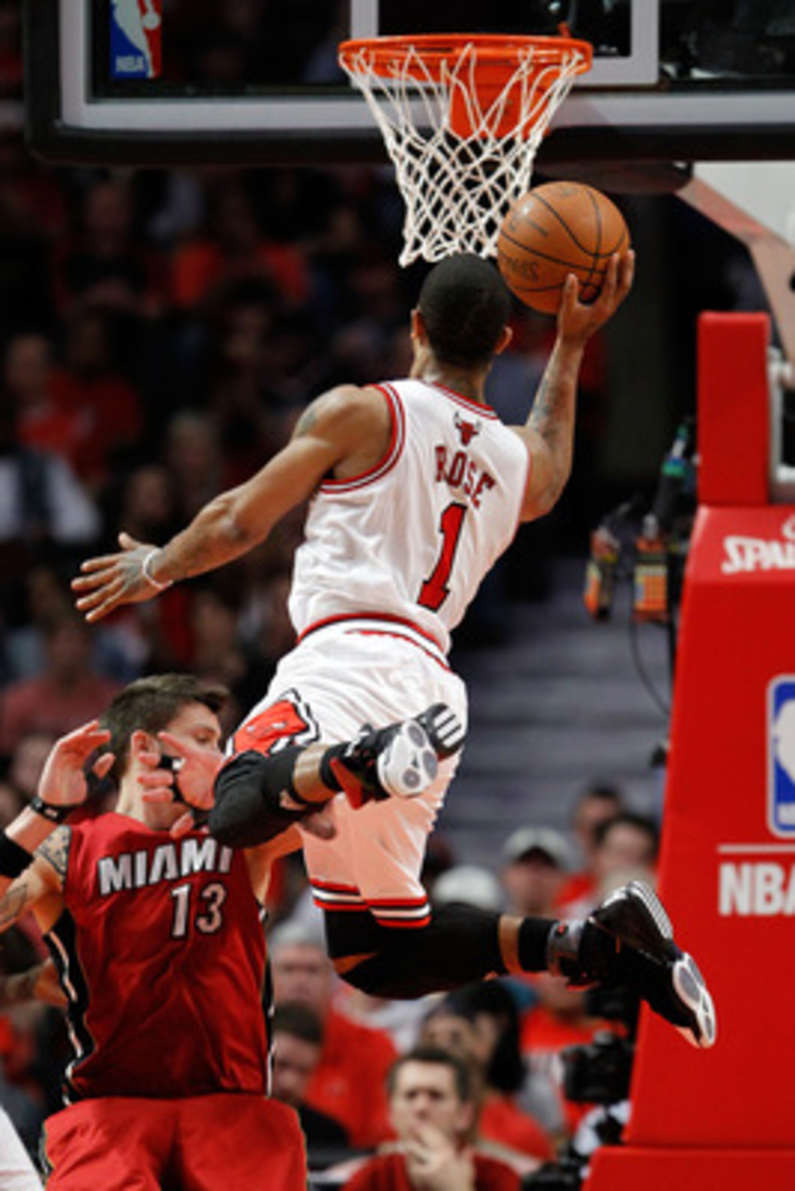 CHICAGO, IL - MAY 18:  Derrick Rose #1 of the Chicago Bulls drives for a shot attempt against the Miami Heat in Game Two of the Eastern Conference Finals during the 2011 NBA Playoffs on May 18, 2011 at the United Center in Chicago, Illinois. The Heat won 