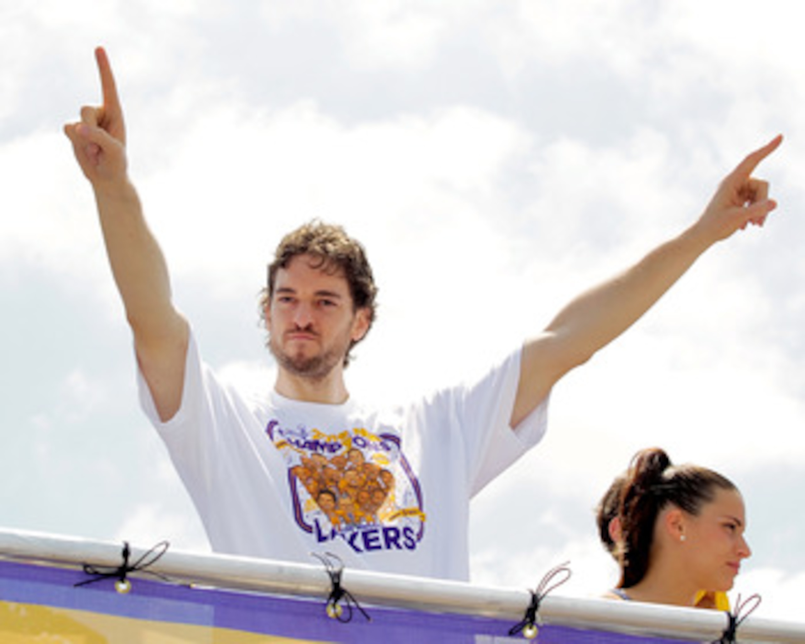 LOS ANGELES, CA - JUNE 21:  Los Angeles Lakers forward Pau Gasol salutes the crowd while riding in the victory parade for the the NBA basketball champion team on June 21, 2010 in Los Angeles, California. The Lakers beat the Boston Celtics 87-79 in 7 games