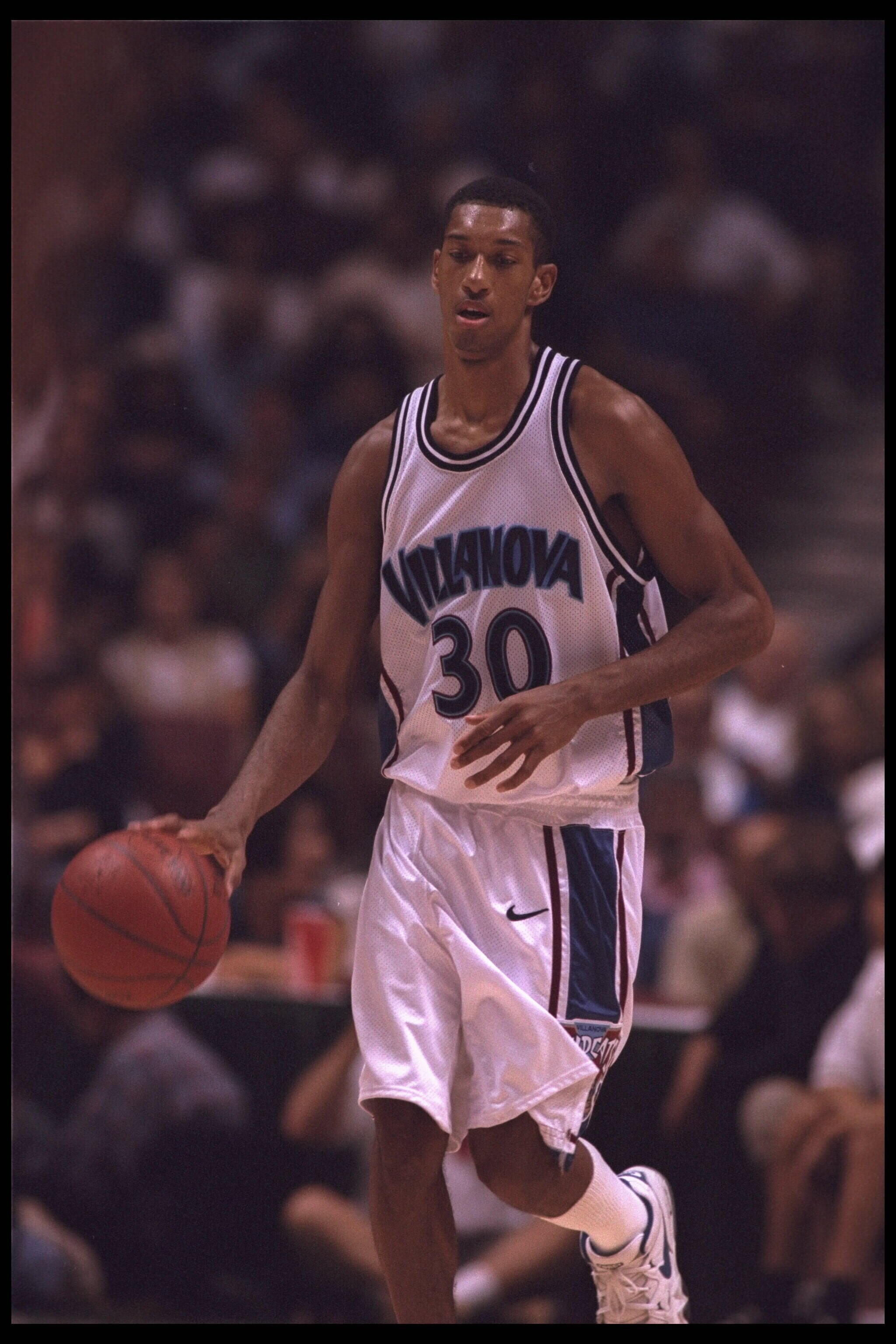 9 Dec 1995:  Guard Kerry Kittles #30 of the Villanova Wildcats takes the ball back to the defense of the Purdue Boilermakers at the John Wooden Classic at Arrowhead Pond in Anaheim, California.  Villanova defeated Purdue 67-50.   Mandatory Credit:  Jed Ja