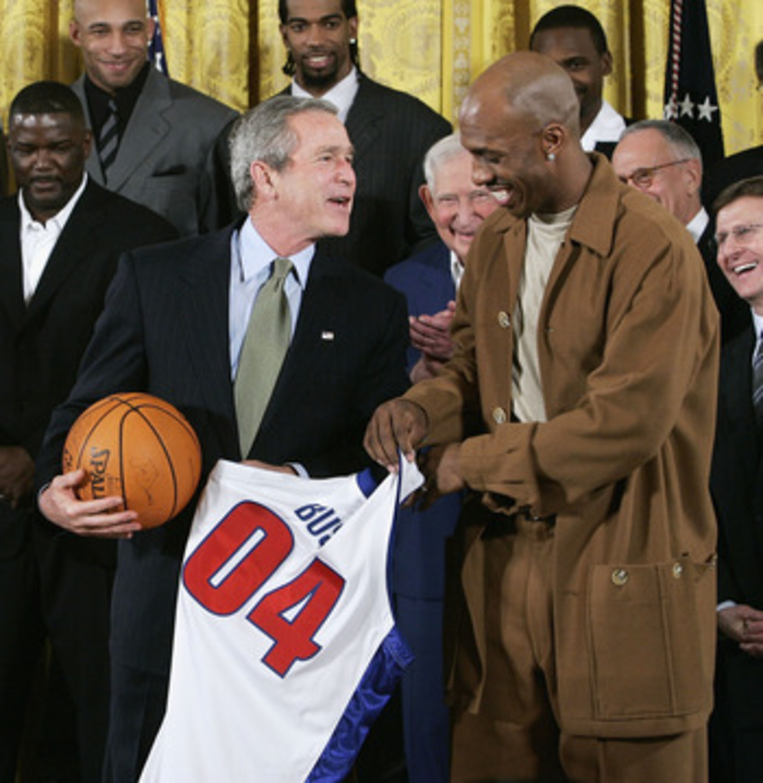 WASHINGTON - JANUARY 31: U.S President George W. Bush receives a jersey as a souvenir from Detroit Pistons player Chauncey Billups, during an East Room event at the White House January 31, 2005 in Washington, DC. President Bush hosted the Detroit Pistons 