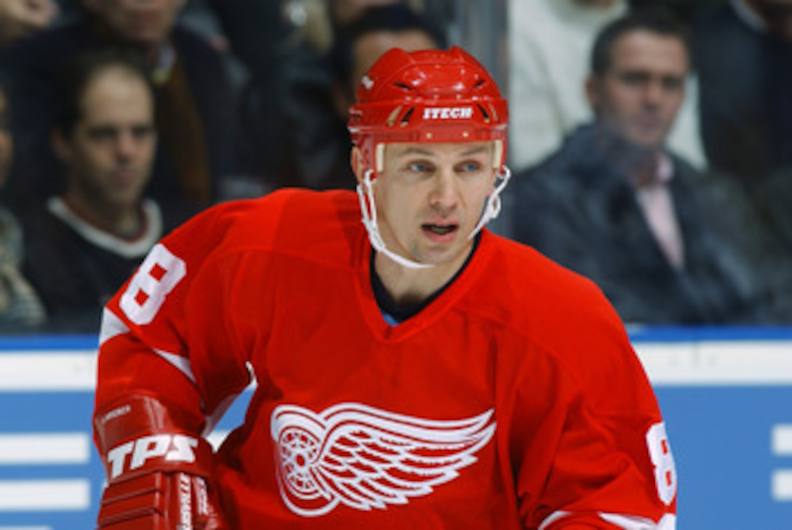 TORONTO - NOVEMBER 16:  Center Igor Larionov #8 of the Detroit Red Wings eyes the play as he skates against the Toronto Maple Leafs during the game at the Air Canada Center on November 16, 2002 in Toronto, Ontario.  The Red Wings won 2-1.  (Photo By Dave
