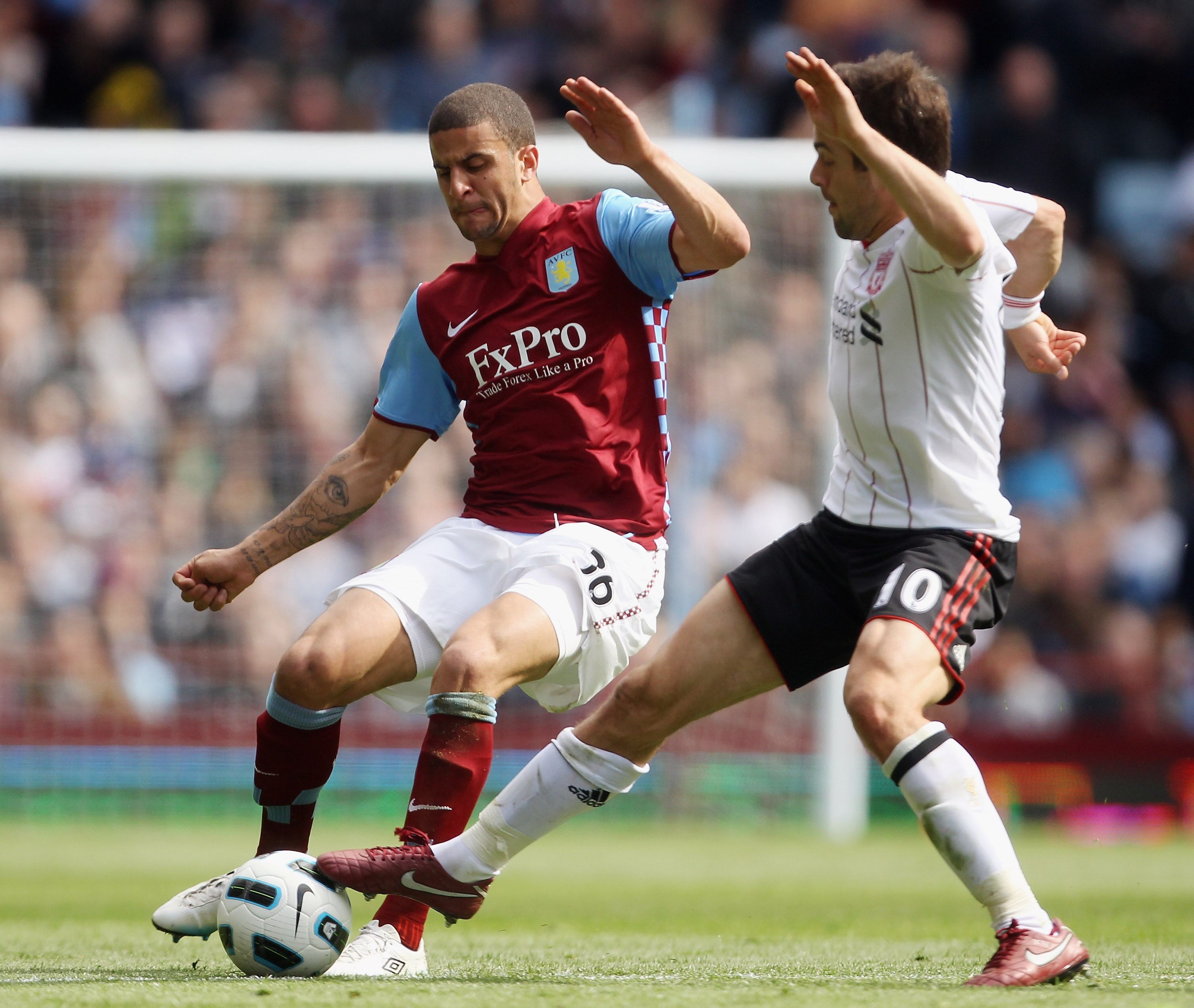 BIRMINGHAM, ENGLAND - MAY 22:  Joe Cole of Liverpool (R) tackles Kyle Walker of Aston Villa during the Barclays Premier League match between Aston Villa and Liverpool at Villa Park on May 22, 2011 in Birmingham, England.  (Photo by Bryn Lennon/Getty Image