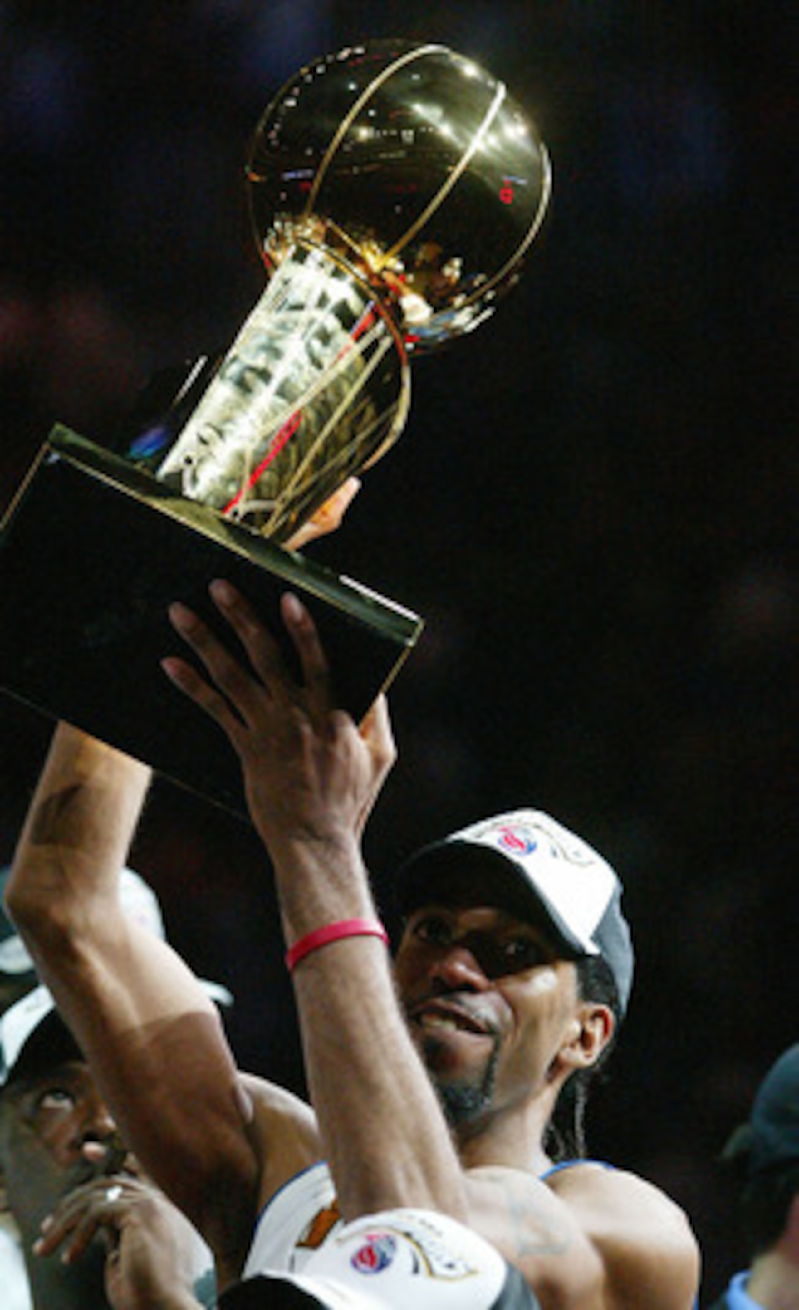 AUBURN HILLS, MI - JUNE 15:  Richard Hamilton #32 of the Detroit Pistons celebrates with the Larry O'Brien NBA Championship trophy after defeating the Los Angeles Lakers 100-87 in game five of the 2004 NBA Finals on June 15, 2004 at The Palace of Auburn H