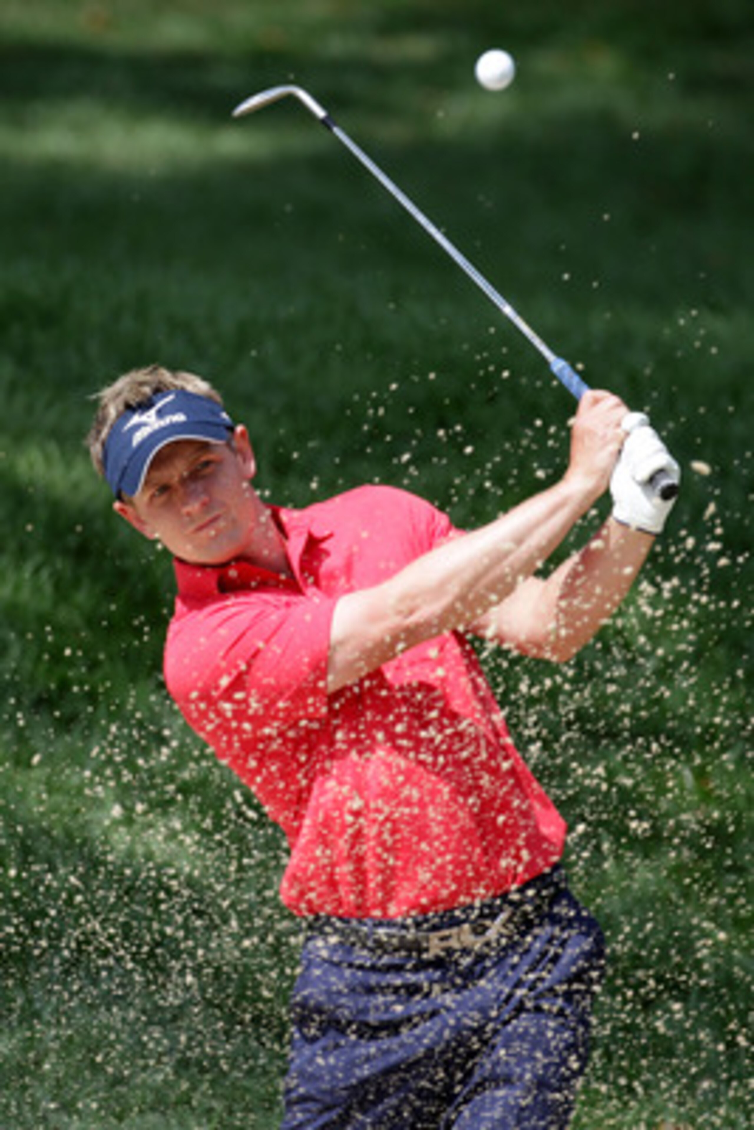 BETHESDA, MD - JUNE 14:  Luke Donald of England  plays a bunker shot during a practice round prior to the start of the 111th U.S. Open at Congressional Country Club on June 14, 2011 in Bethesda, Maryland.  (Photo by Ross Kinnaird/Getty Images)