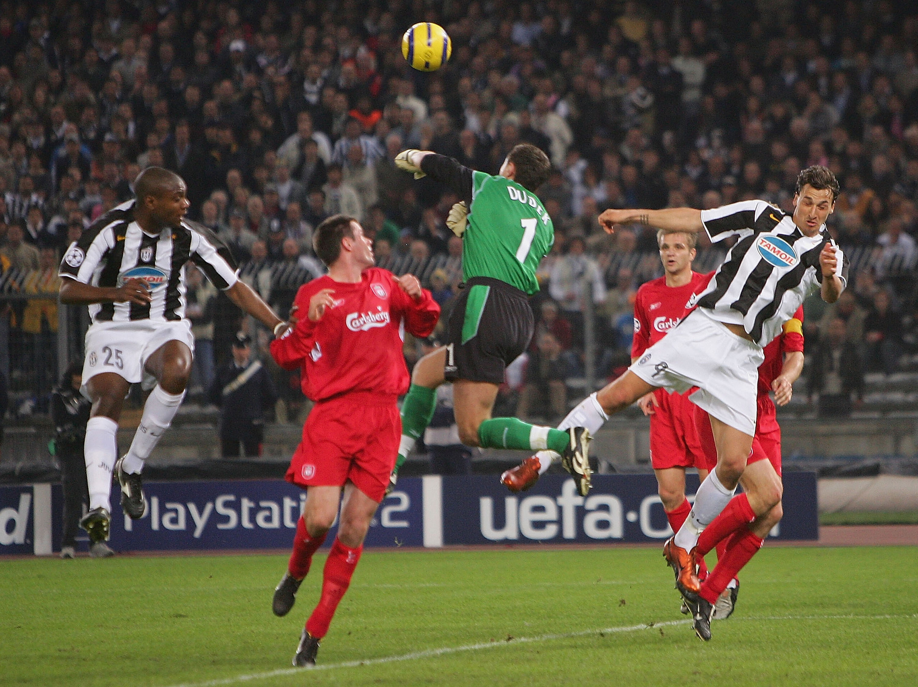 TURIN, ITALY - APRIL 13:  Jerzy Dudek of Liverpool clears from Marcelo Zalayeta (L) and Zlatan Ibrahimovic of Juventus during the UEFA Champions League quarter-final second leg between Juventus and Liverpool at the Delle Alpi Stadium on April 13, 2005  in