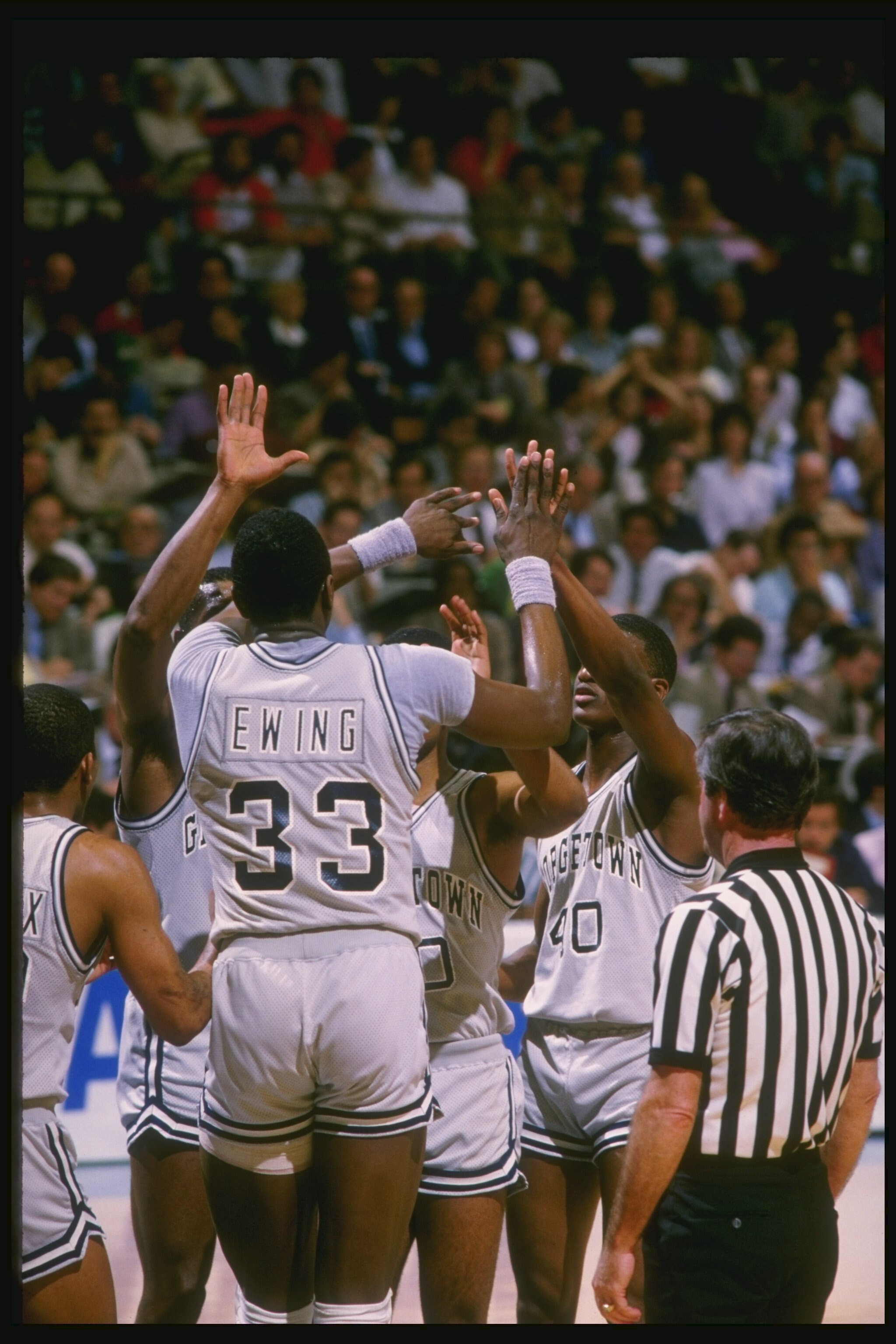 1984:  Center Patrick Ewing of the Georgetown Hoyas high fives his teammates during a game. Mandatory Credit: Allsport  /Allsport