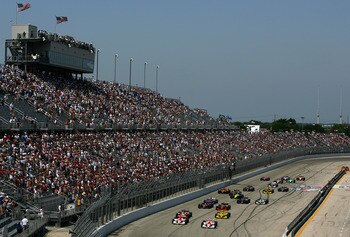 MILWAUKEE - JULY 24:  Sam Hornish Jr. driving the #6 Marlboro Team Penske Dallara Toyota and his teammate Helio Castroneves #3 lead the field at the start of the Indy Racing League IndyCar Series ABC Supply Company A.J.Foyt 225 on July 24, 2005 at the Mil