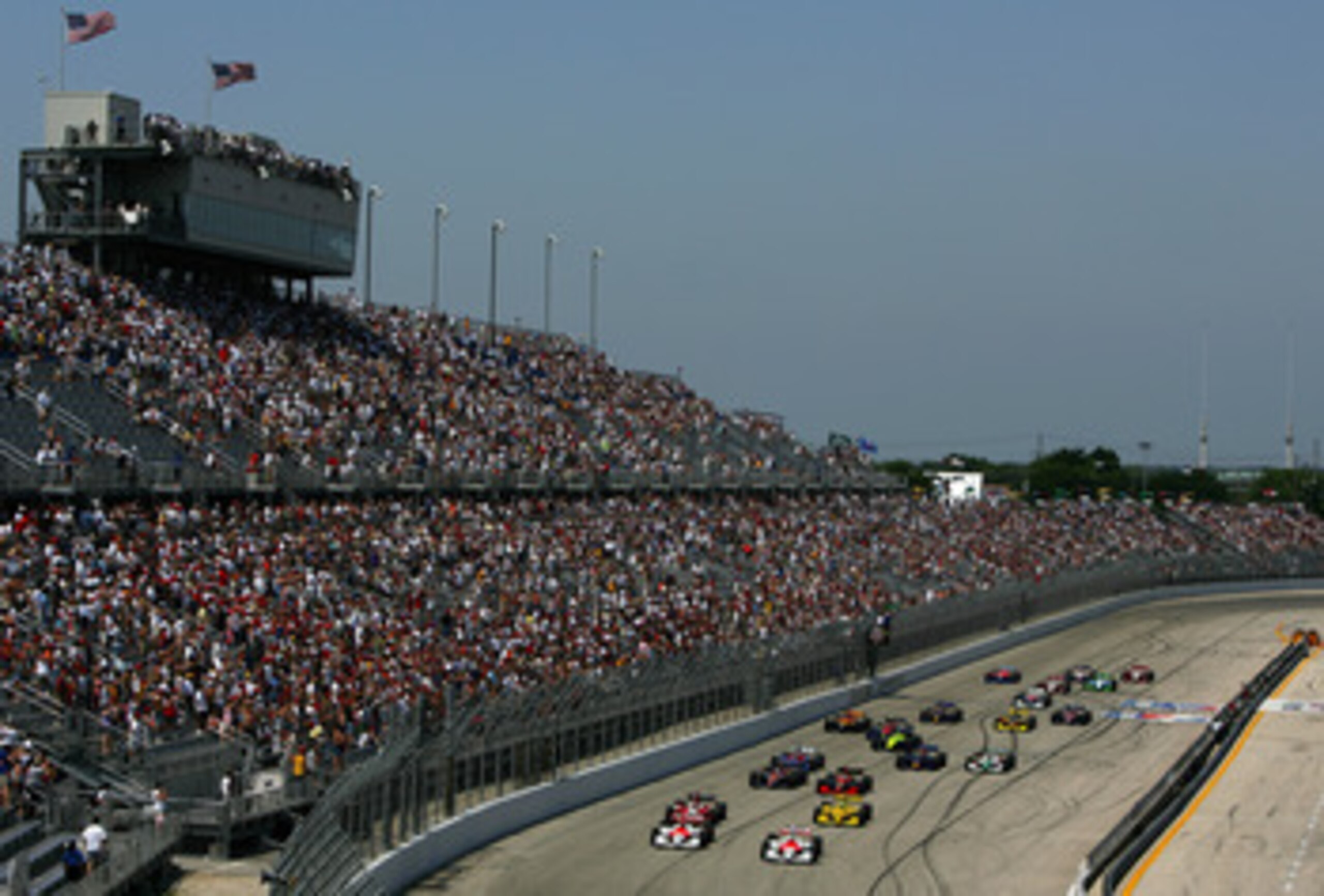 MILWAUKEE - JULY 24:  Sam Hornish Jr. driving the #6 Marlboro Team Penske Dallara Toyota and his teammate Helio Castroneves #3 lead the field at the start of the Indy Racing League IndyCar Series ABC Supply Company A.J.Foyt 225 on July 24, 2005 at the Mil