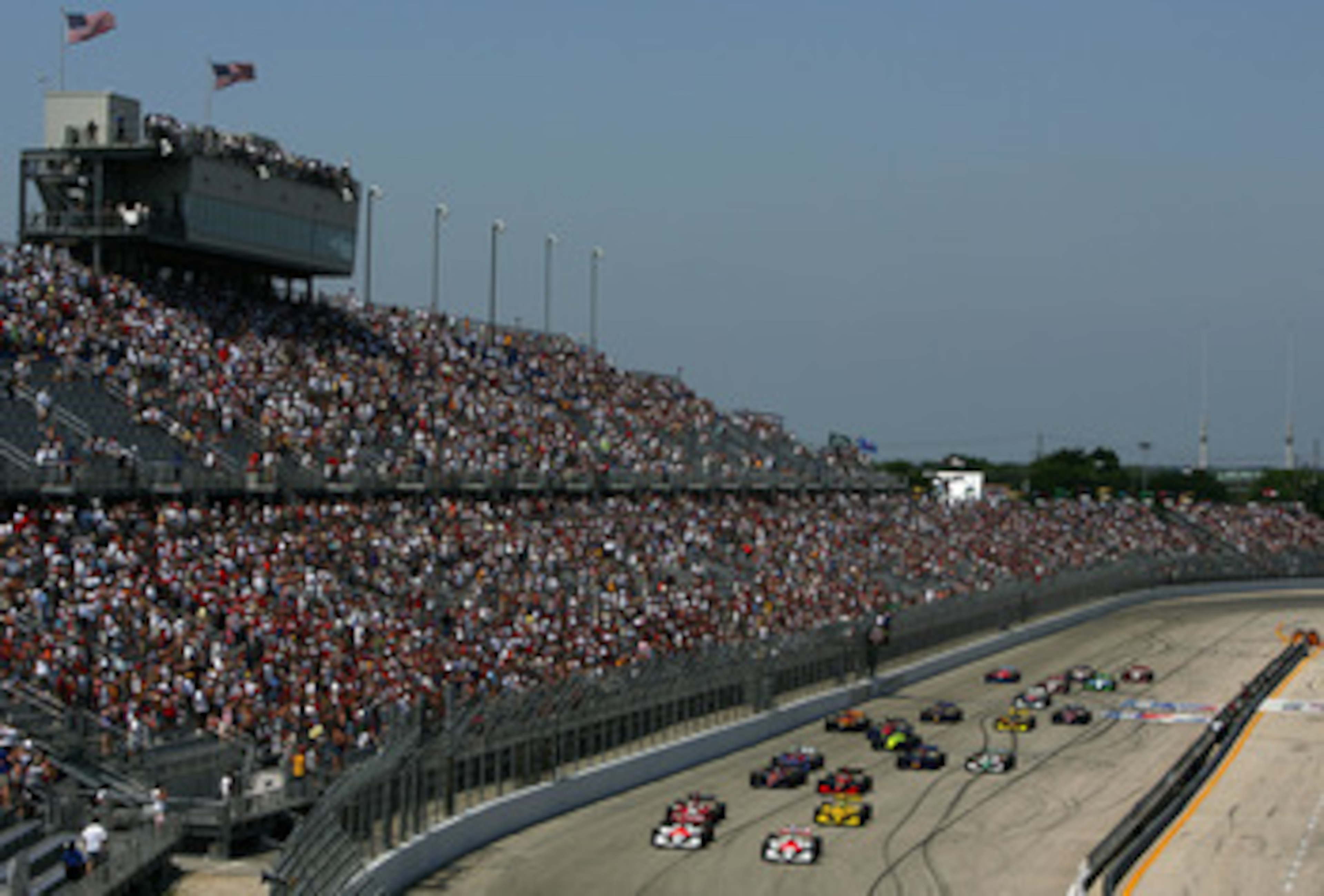 MILWAUKEE - JULY 24:  Sam Hornish Jr. driving the #6 Marlboro Team Penske Dallara Toyota and his teammate Helio Castroneves #3 lead the field at the start of the Indy Racing League IndyCar Series ABC Supply Company A.J.Foyt 225 on July 24, 2005 at the Mil