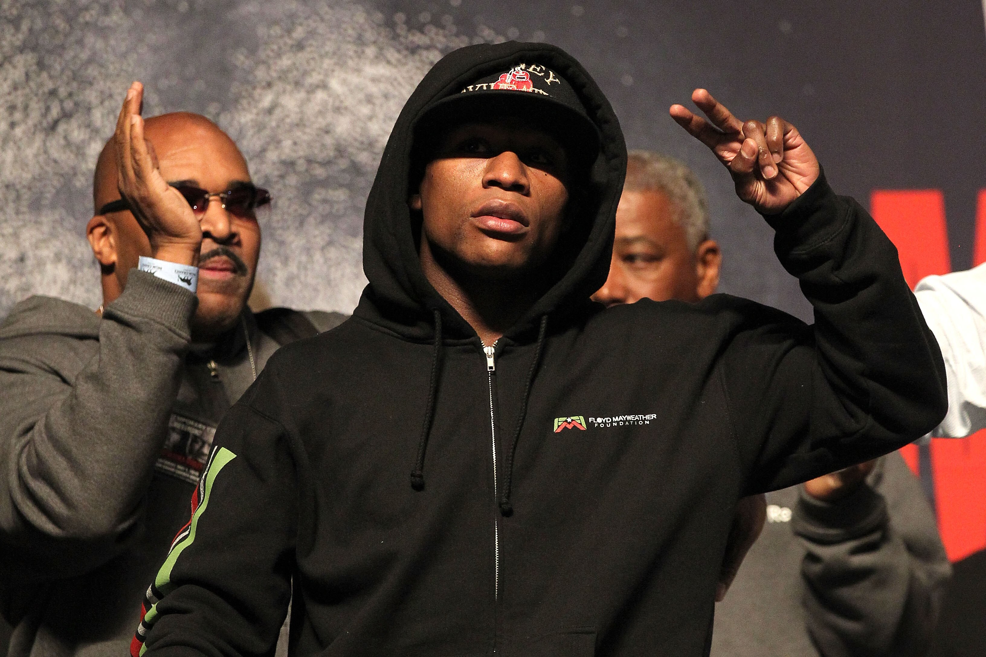 LAS VEGAS - APRIL 30:  Boxer Floyd Mayweather Jr. waves to the crowd before stepping on the scale at the weigh-in for his bout against Shane Mosley at the MGM Grand Garden Arena on April 30, 2010 in Las Vegas, Nevada. Mayweather and Mosley will meet in a