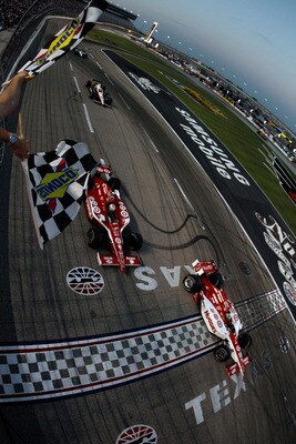 FORT WORTH, TX - JUNE 11:  Dario Franchitti of Scotland, driver of the #10 Target Chip Ganassi Racing Dallara Honda, crosses the finish line ahead of teammate Scott Dixon of New Zealand, driver of the #9 Target Chip Ganassi Racing Dallara Honda, to win ra