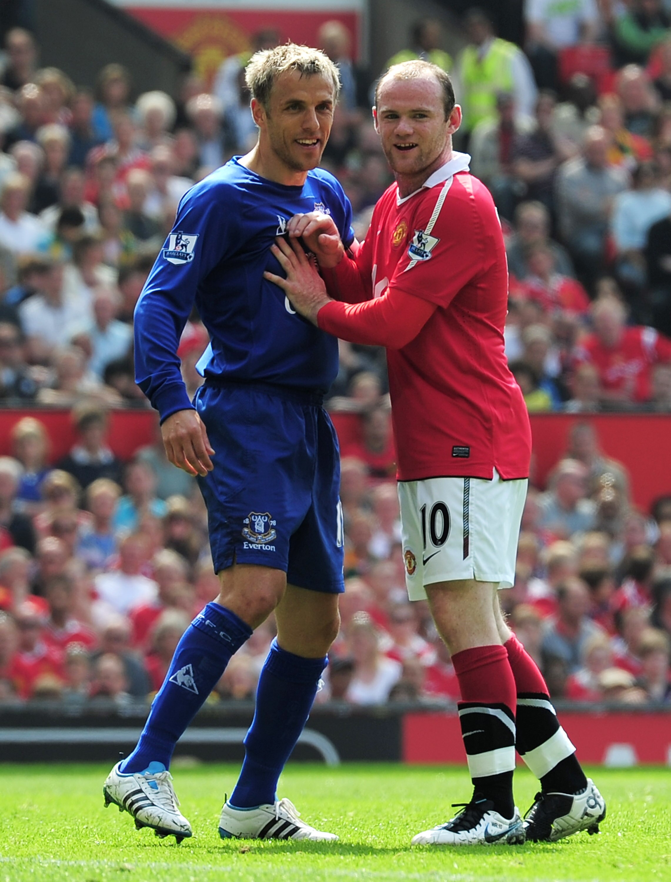 MANCHESTER, ENGLAND - APRIL 23: Phil Neville of Everton marks Wayne Rooney of Manchester United during the Barclays Premier League match between Manchester United and Everton at Old Trafford on April 23, 2011 in Manchester, England.  (Photo by Shaun Botte