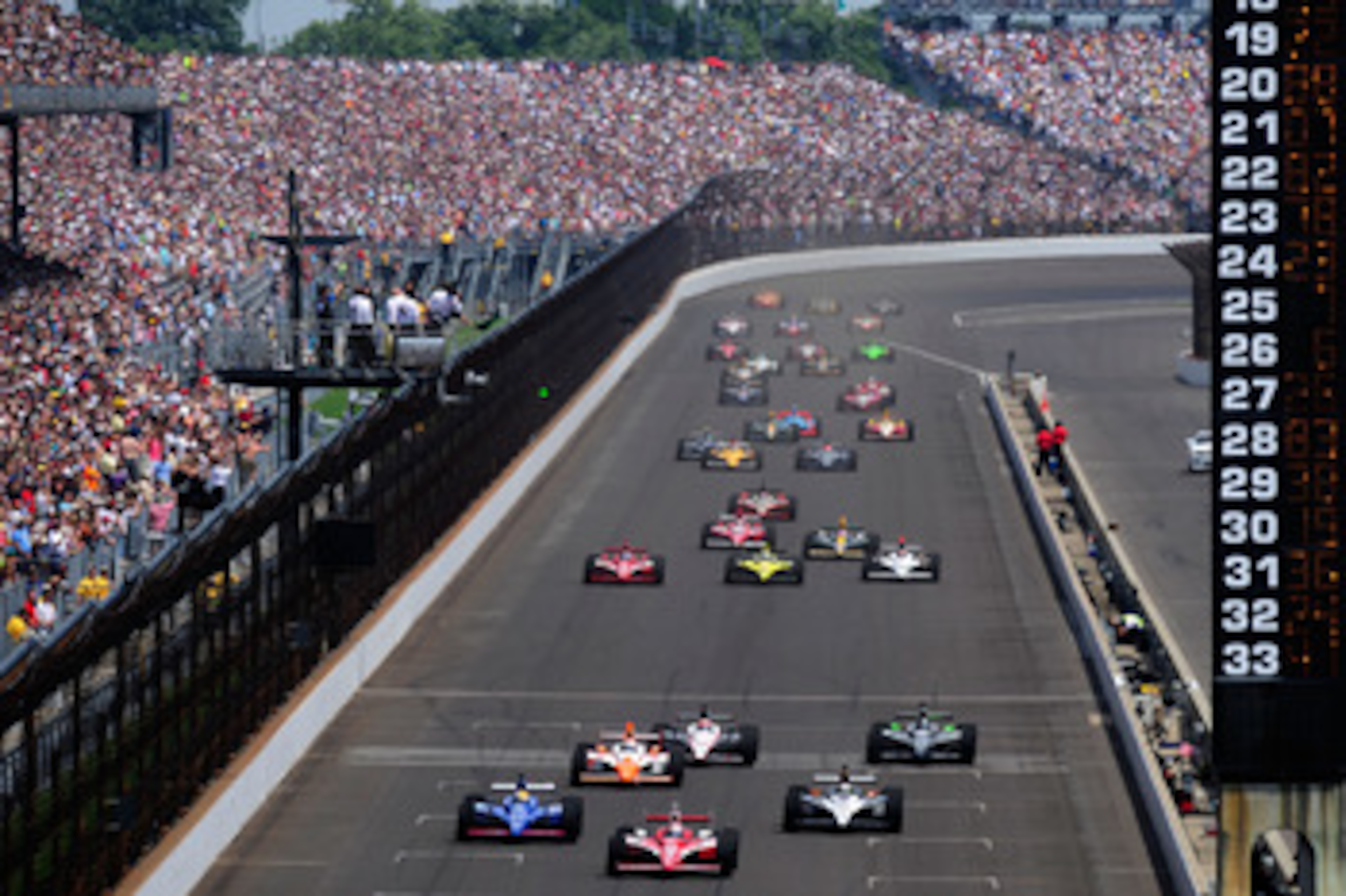 INDIANAPOLIS, IN - MAY 29:  Scott Dixon of New Zealand, driver of the #9 Target Chip Ganassi Racing Dallara Honda, leads the field during the IZOD IndyCar Series Indianapolis 500 Mile Race at Indianapolis Motor Speedway on May 29, 2011 in Indianapolis, In