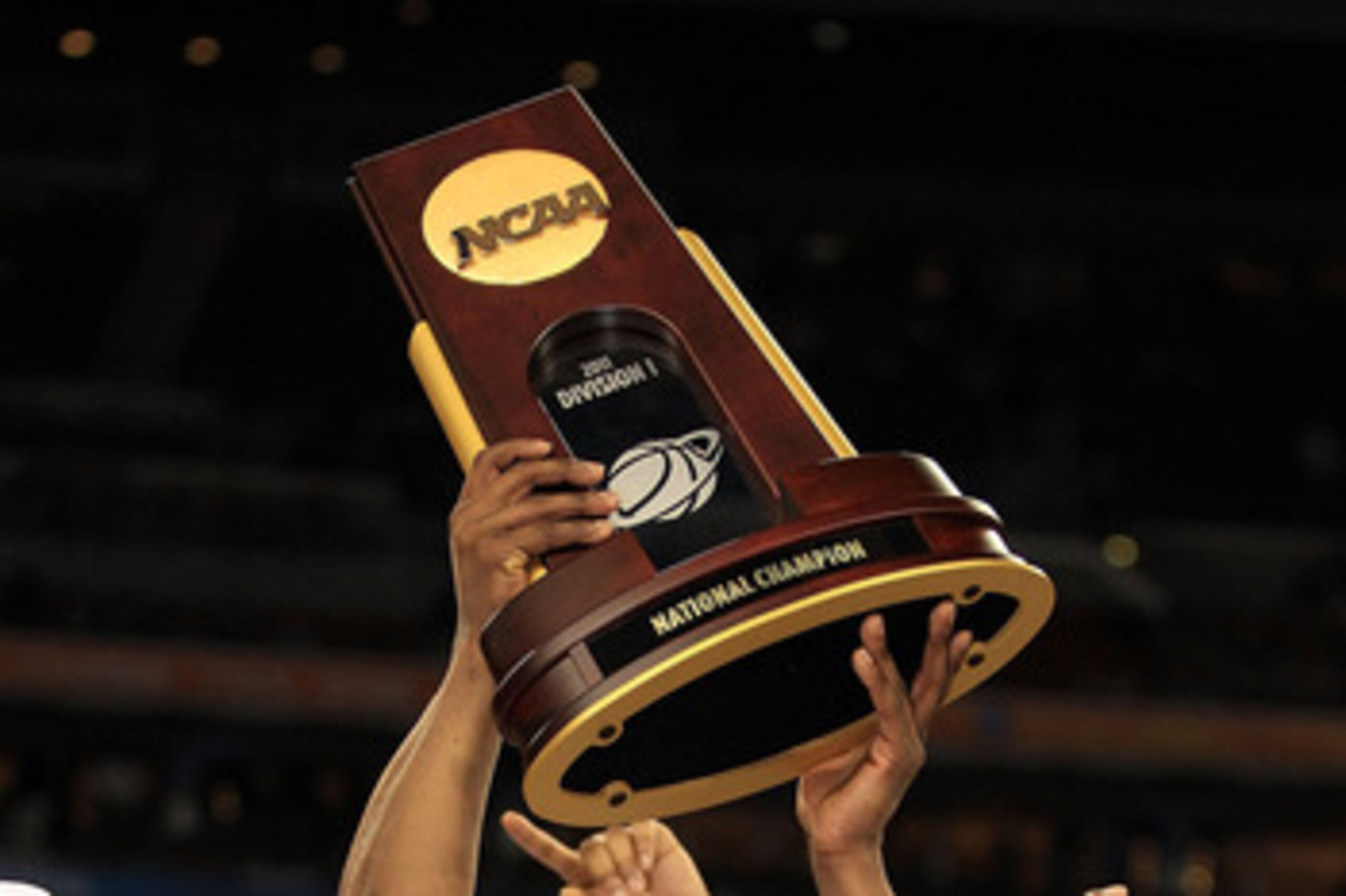 HOUSTON, TX - APRIL 04:  Shabazz Napier #13 and Kemba Walker #15 of the Connecticut Huskies celebrate with the trophy after defeating the Butler Bulldogs to win the National Championship Game of the 2011 NCAA Division I Men's Basketball Tournament by a sc