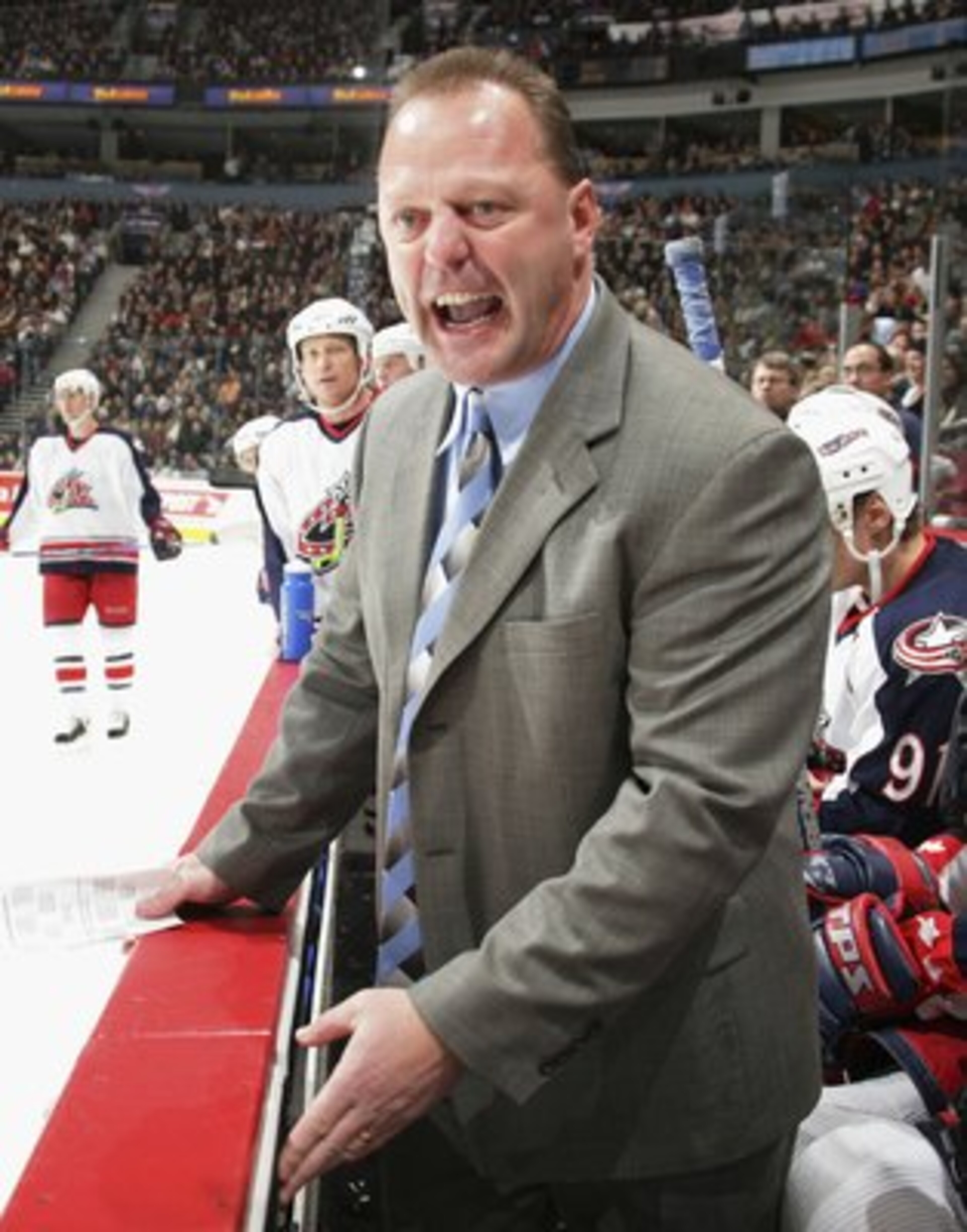 VANCOUVER - FEBRUARY 6: Columbus Blue Jackets head coach Gerard Gallant complains to the referee that Todd Bertuzzi of the Vancouver Canucks was playing with blood on his face durig their game at General Motors Place on February 6, 2006 in Vancouver, Cana