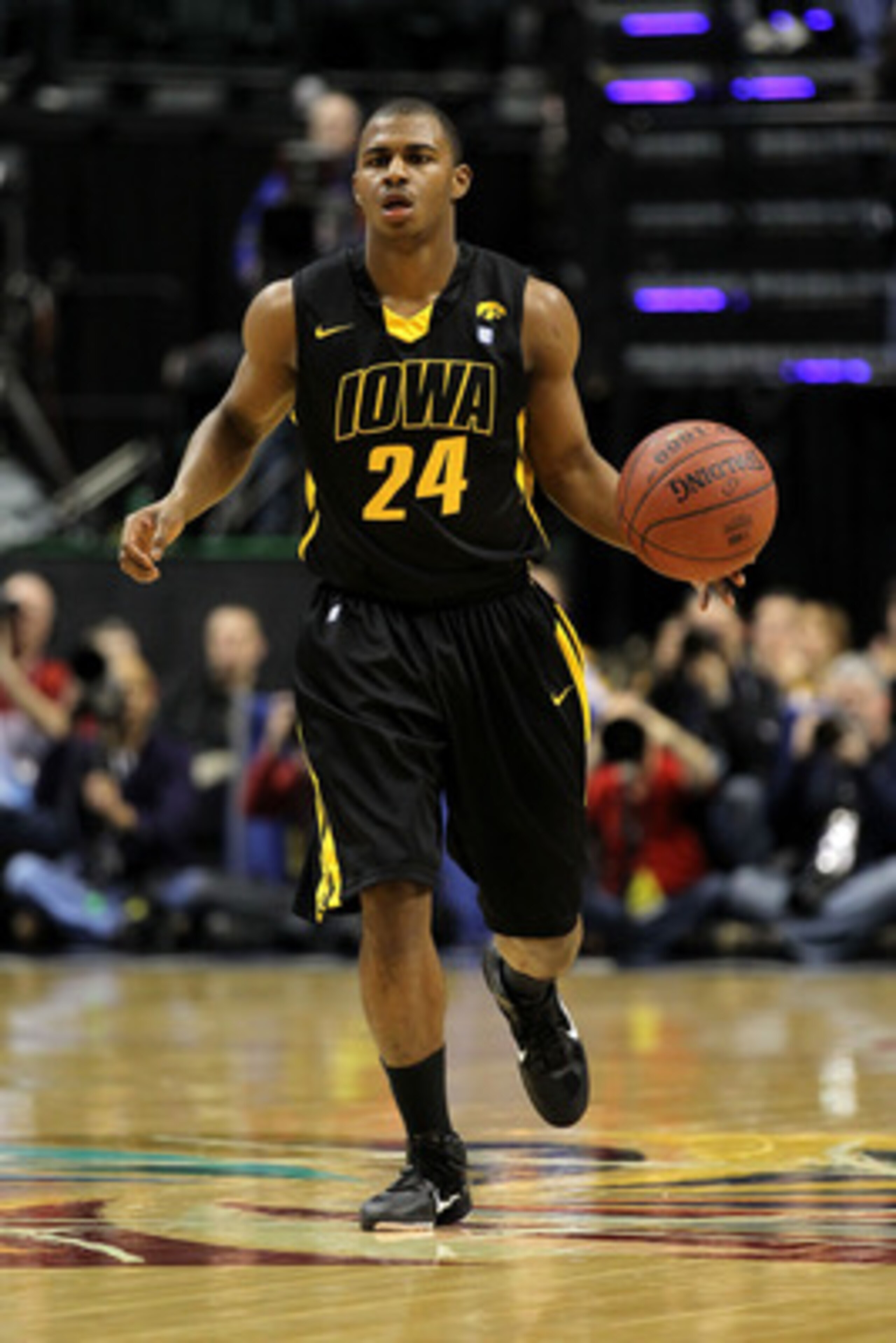 INDIANAPOLIS, IN - MARCH 10:  Bryce Cartwright #24 of the Iowa Hawkeyes brings the ball up court against the Michigan State Spartans during the first round of the 2011 Big Ten Men's Basketball Tournament at Conseco Fieldhouse on March 10, 2011 in Indianap