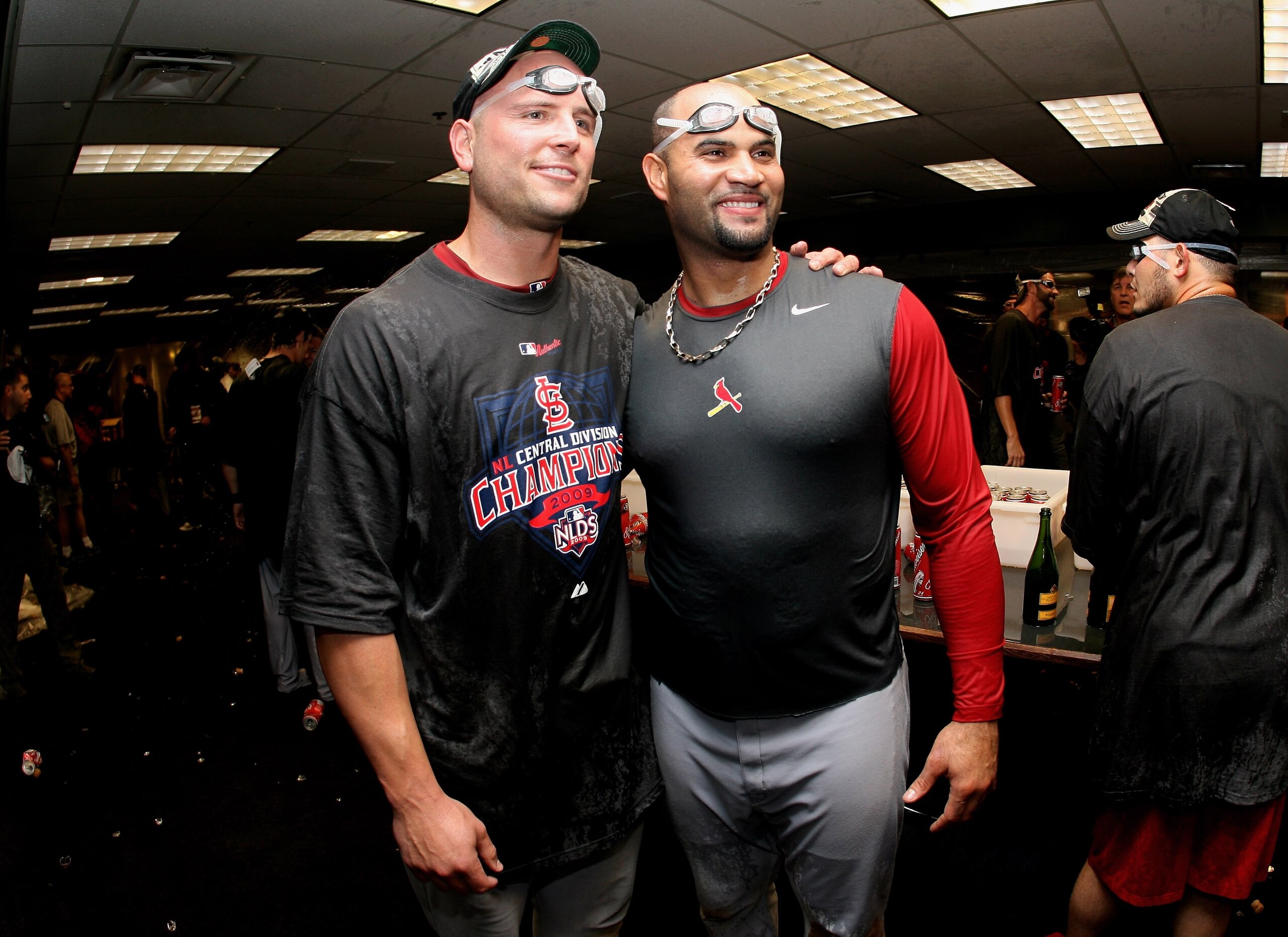DENVER - SEPTEMBER 26:  (L-R) Matt Holliday and Albert Pujols of the St. Louis Cardinals celebrate clinching the National League Central Division after defeating the Colorado Rockies at Coors Field on September 26, 2009 in Denver, Colorado. The Cardinals