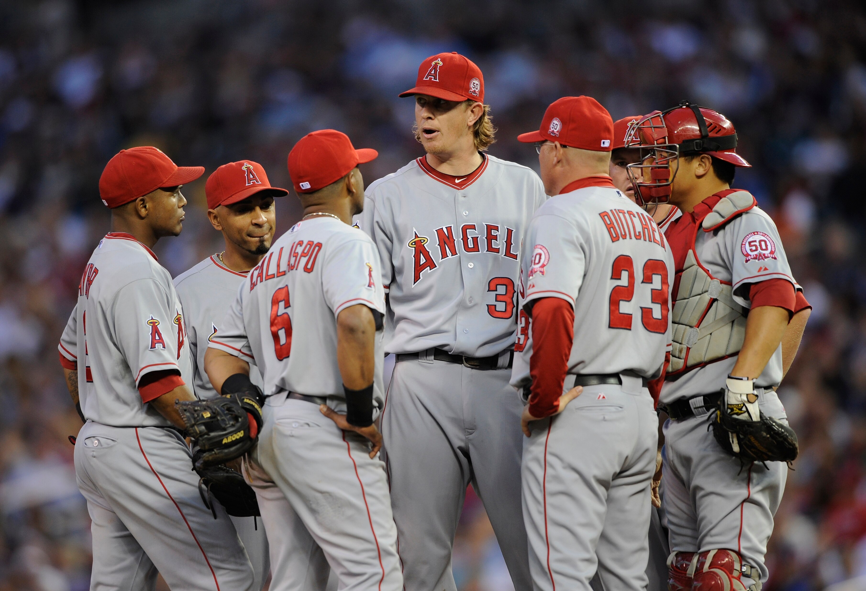 MINNEAPOLIS, MN - MAY 28: Starting pitcher Jered Weaver #36 of the Los Angeles Angels of Anaheim and pitching coach Mike Butcher #23 of the Los Angeles Angels of Anaheim speak on the mound with the Los Angeles Angels of Anaheim infield during the ninth in