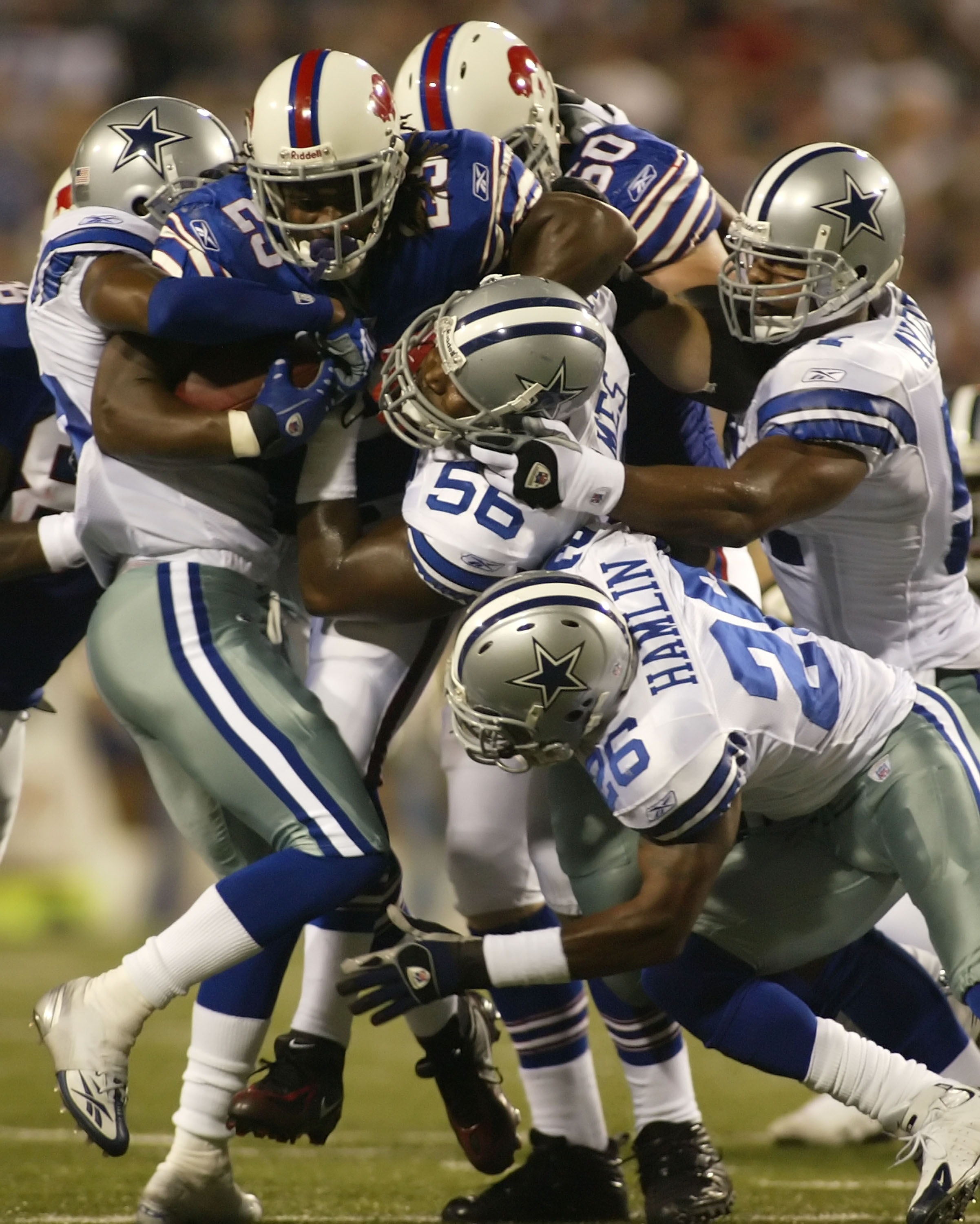 ORCHARD PARK, NY - OCTOBER 8: Marshawn Lynch #23 of the Buffalo Bills drives through four Dallas Cowboys players at Ralph Wilson Stadium October 8, 2007 in Orchard Park, New York.  (Photo by Rick Stewart/Getty Images)
