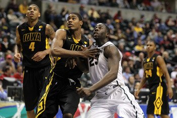INDIANAPOLIS, IN - MARCH 10:  Draymond Green #23 of the Michigan State Spartans fights for rebound position against Melsahn Basabe #1 of the Iowa Hawkeyes during the first round of the 2011 Big Ten Men's Basketball Tournament at Conseco Fieldhouse on Marc