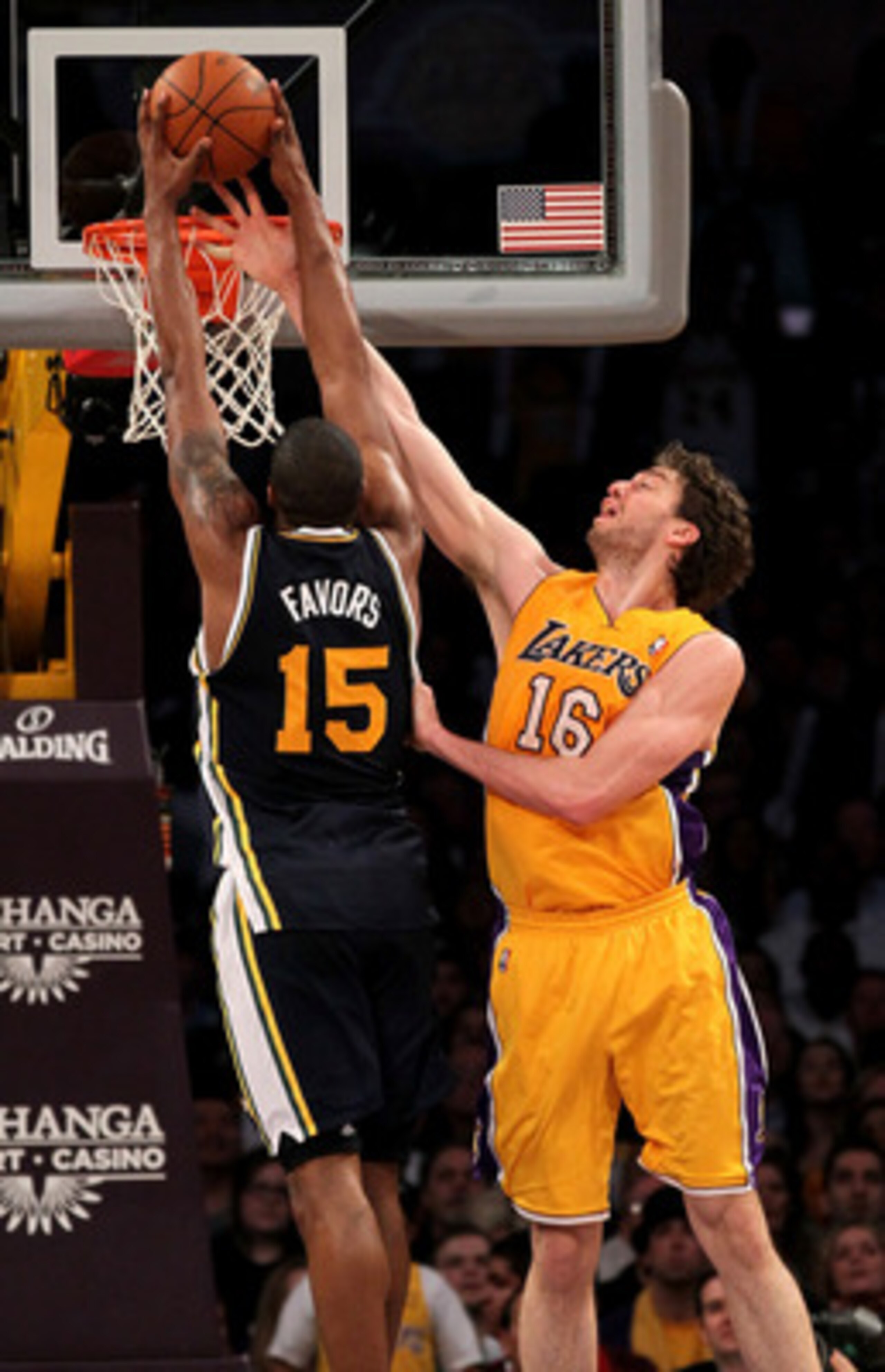 LOS ANGELES, CA - APRIL 05:  Pau Gasol #16 of the Los Angeles Lakers blocks a shot by Derrick Favors #15 of the Utah Jazz at Staples Center on April 5, 2011 in Los Angeles, California. The Jazz won 86-85.  NOTE TO USER: User expressly acknowledges and agr