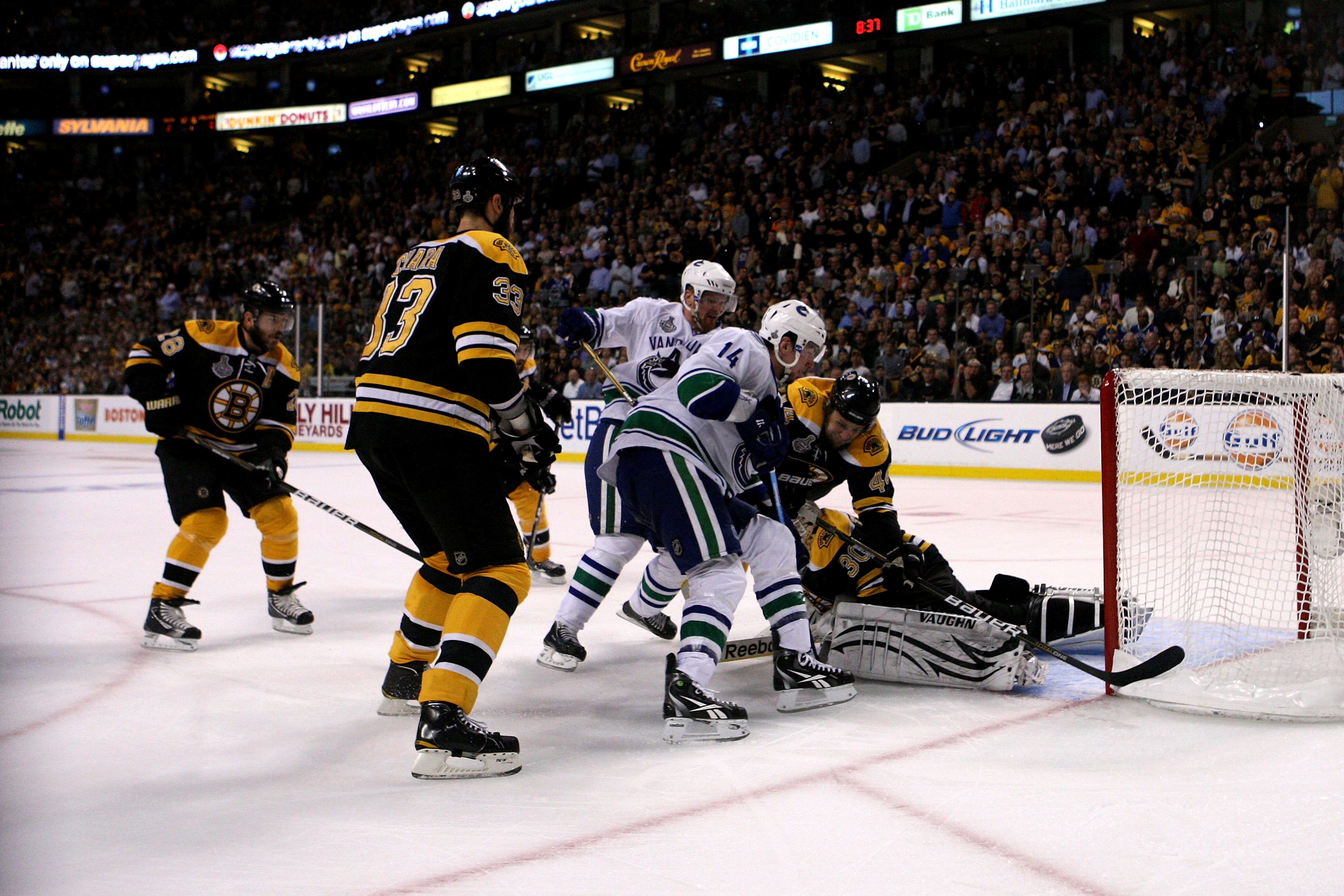 BOSTON, MA - JUNE 13:  Tim Thomas #30 of the Boston Bruins tends goal against Alex Burrows #14 of the Vancouver Canucks during Game Six of the 2011 NHL Stanley Cup Final at TD Garden on June 13, 2011 in Boston, Massachusetts.  (Photo by Bruce Bennett/Gett