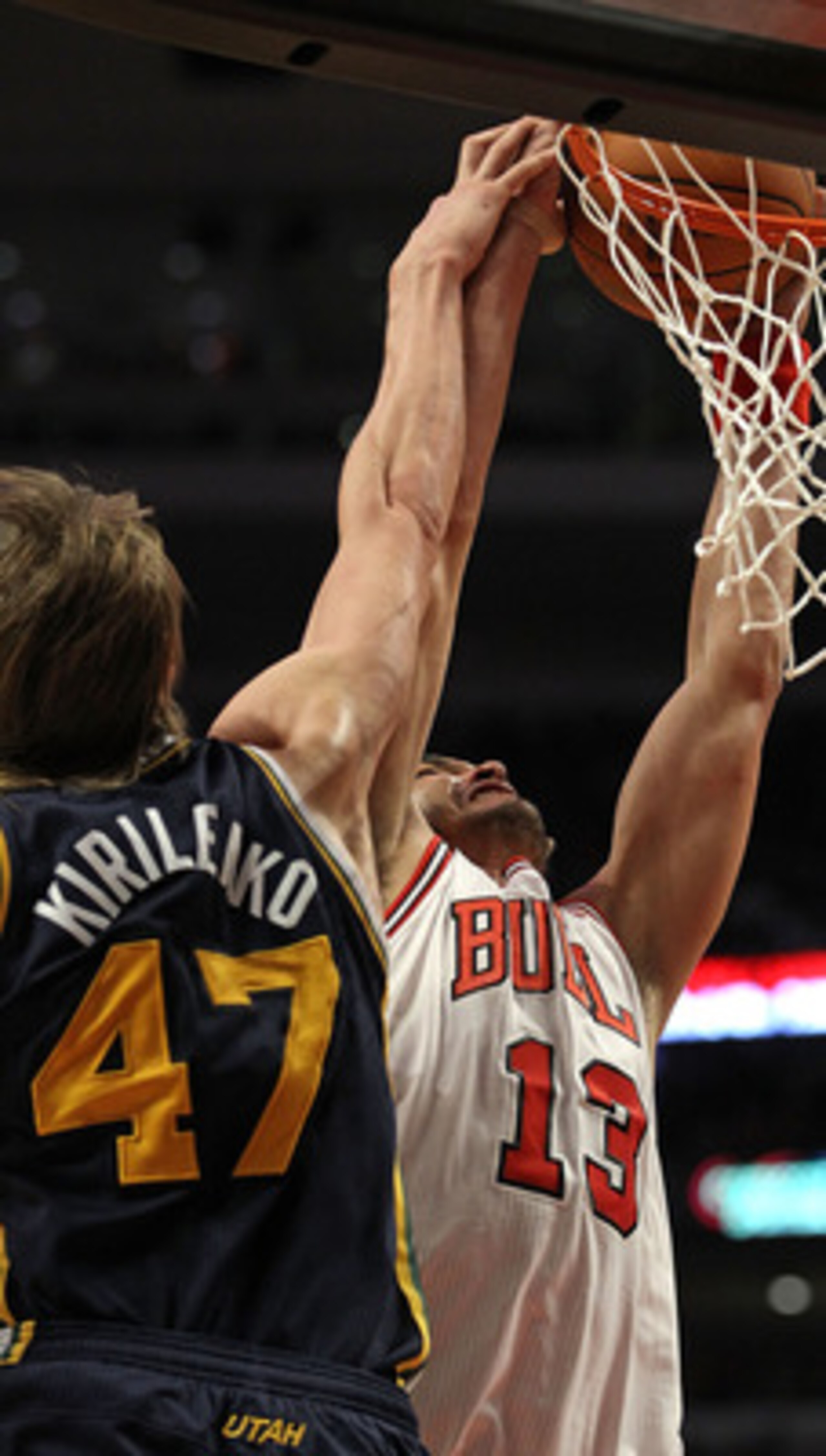 CHICAGO, IL - MARCH 12: Joakim Noah #13 of the Chicago Bulls dunks the ball against Andrei Kirilenko #47 of the Utah Jazz at the United Center on March 12, 2011 in Chicago, Illinois. The Bulls defeated the Jazz 118-100. NOTE TO USER: User expressly acknow