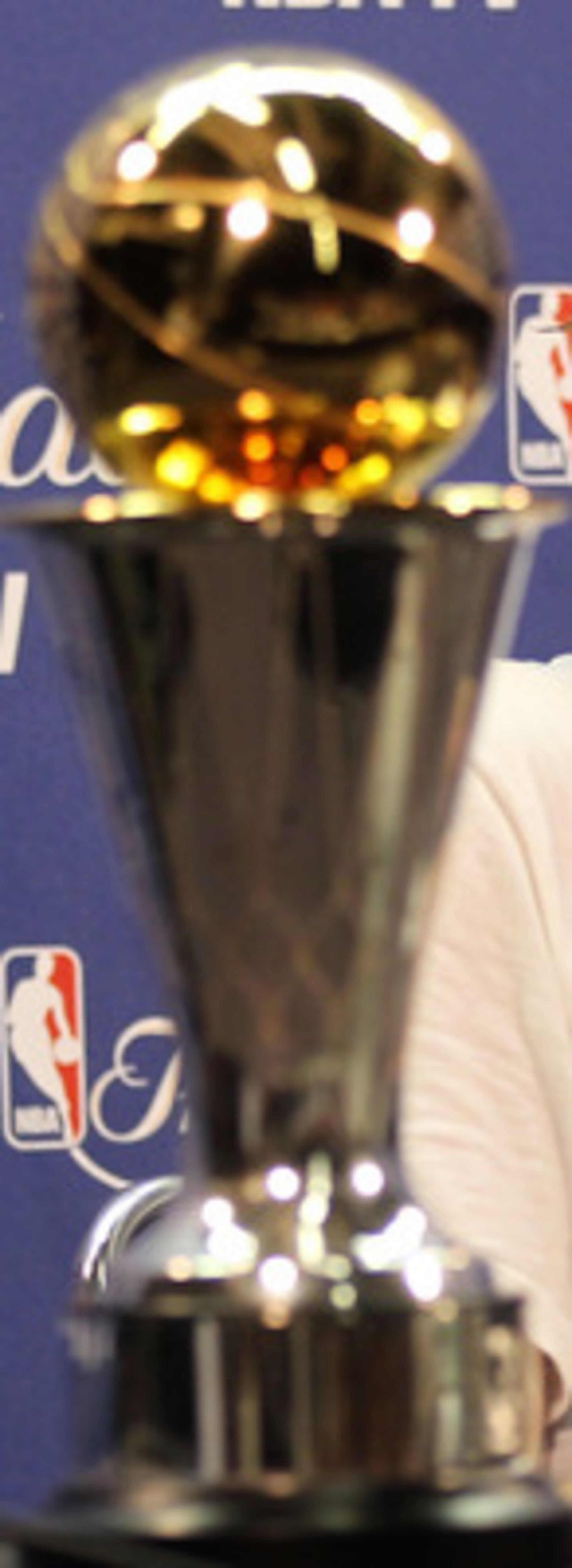 MIAMI, FL - JUNE 12:  Finals MVP Dirk Nowitzki #41 of the Dallas Mavericks answers questions form the media at a post game press conference with the Bill Russell Finals MVP trophy after the Mavericks won 105-95 against the Miami Heat in Game Six of the 20