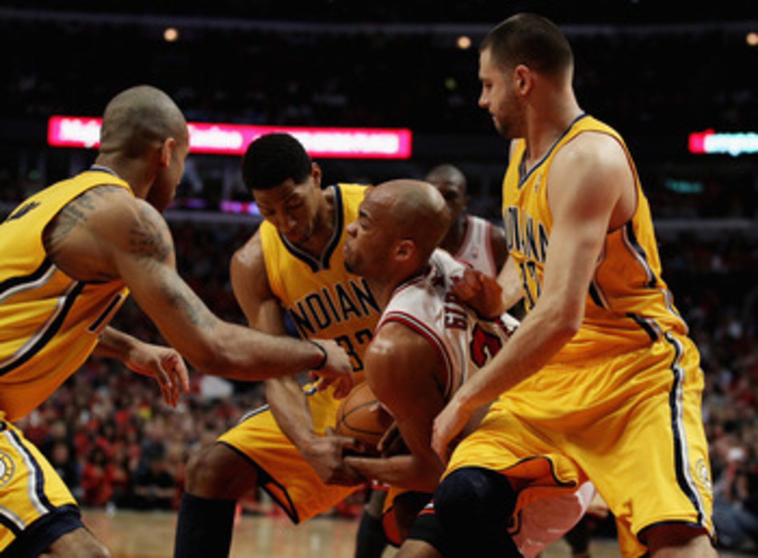 CHICAGO, IL - APRIL 26: Taj Gibson #22 of the Chicago Bulls battles for the ball with (L-R) Dahntay Jones #1, Danny Granger #33 and Josh McRoberts #32 of the Indiana Pacers in Game Five of the Eastern Conference Quarterfinals in the 2011 NBA Playoffs at t