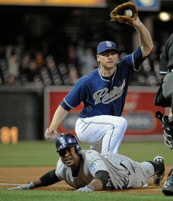 SAN DIEGO, CA - JUNE 6: Chris Nelson #10 of the Colorado Rockies is tagged out at third base by Chase Headley #7 of the San Diego Padres during the sixth inning of a baseball game at Petco Park on June 6, 2011 in San Diego, California. Nelson tried to str SAN DIEGO, CA - JUNE 6: Chris Nelson #10 of the Colorado Rockies is tagged out at third base by Chase Headley #7 of the San Diego Padres during the sixth inning of a baseball game at Petco Park on June 6, 2011 in San Diego, California. Nelson tried to str
