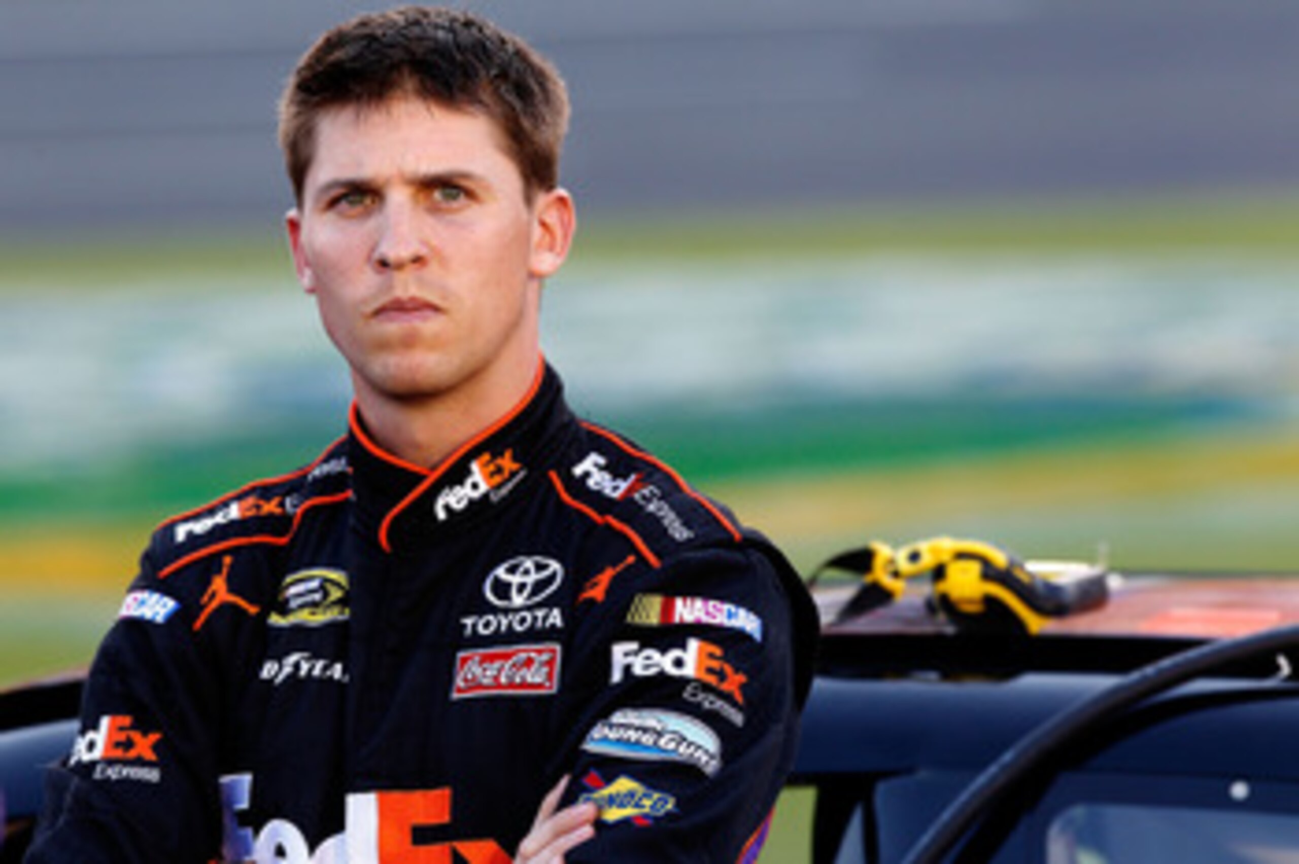 CHARLOTTE, NC - MAY 26: Denny Hamlin, driver of the #11 FedEx Express Toyota, stands on the grid during qualifying for the NASCAR Sprint Cup Series Coca-Cola 600 at Charlotte Motor Speedway on May 26, 2011 in Charlotte, North Carolina. (Photo by Geoff B CHARLOTTE, NC - MAY 26: Denny Hamlin, driver of the #11 FedEx Express Toyota, stands on the grid during qualifying for the NASCAR Sprint Cup Series Coca-Cola 600 at Charlotte Motor Speedway on May 26, 2011 in Charlotte, North Carolina. (Photo by Geoff B