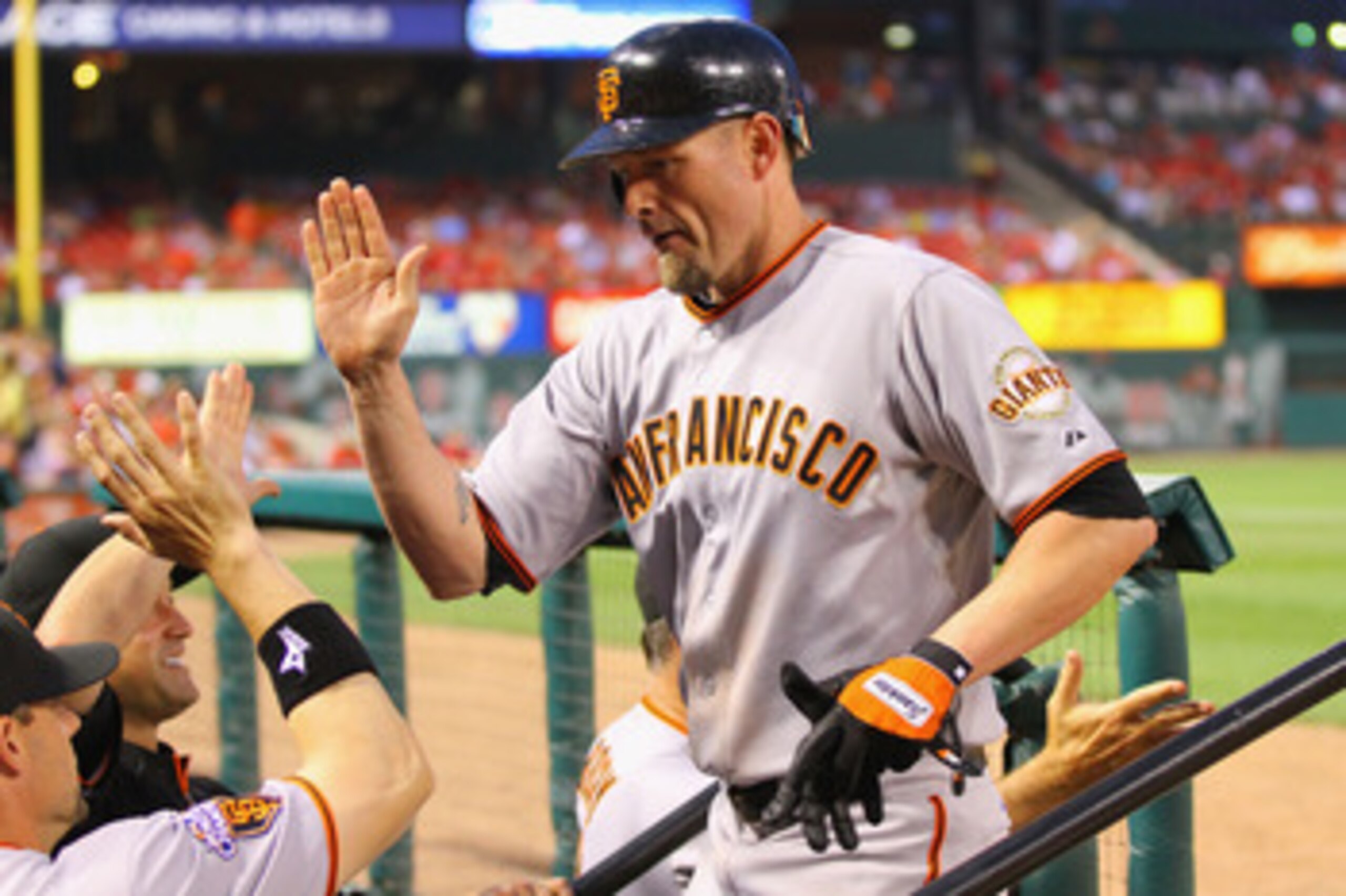 ST. LOUIS, MO - JUNE 2: Aubrey Huff #17 of the San Francisco Giants is congratulated by teammates after hitting a two-run home run against the St. Louis Cardinals at Busch Stadium on June 2, 2011 in St. Louis, Missouri.  (Photo by Dilip Vishwanat/Getty Im