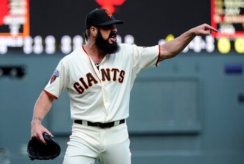 SAN FRANCISCO, CA - APRIL 8: Brian Wilson #38 of the San Francisco Giants after being taken out of the game against the St. Louis Cardinals in the 9th inning let home-plate umpire Bruce Dreckman know how he felt about balls and strike calls during a MLB b