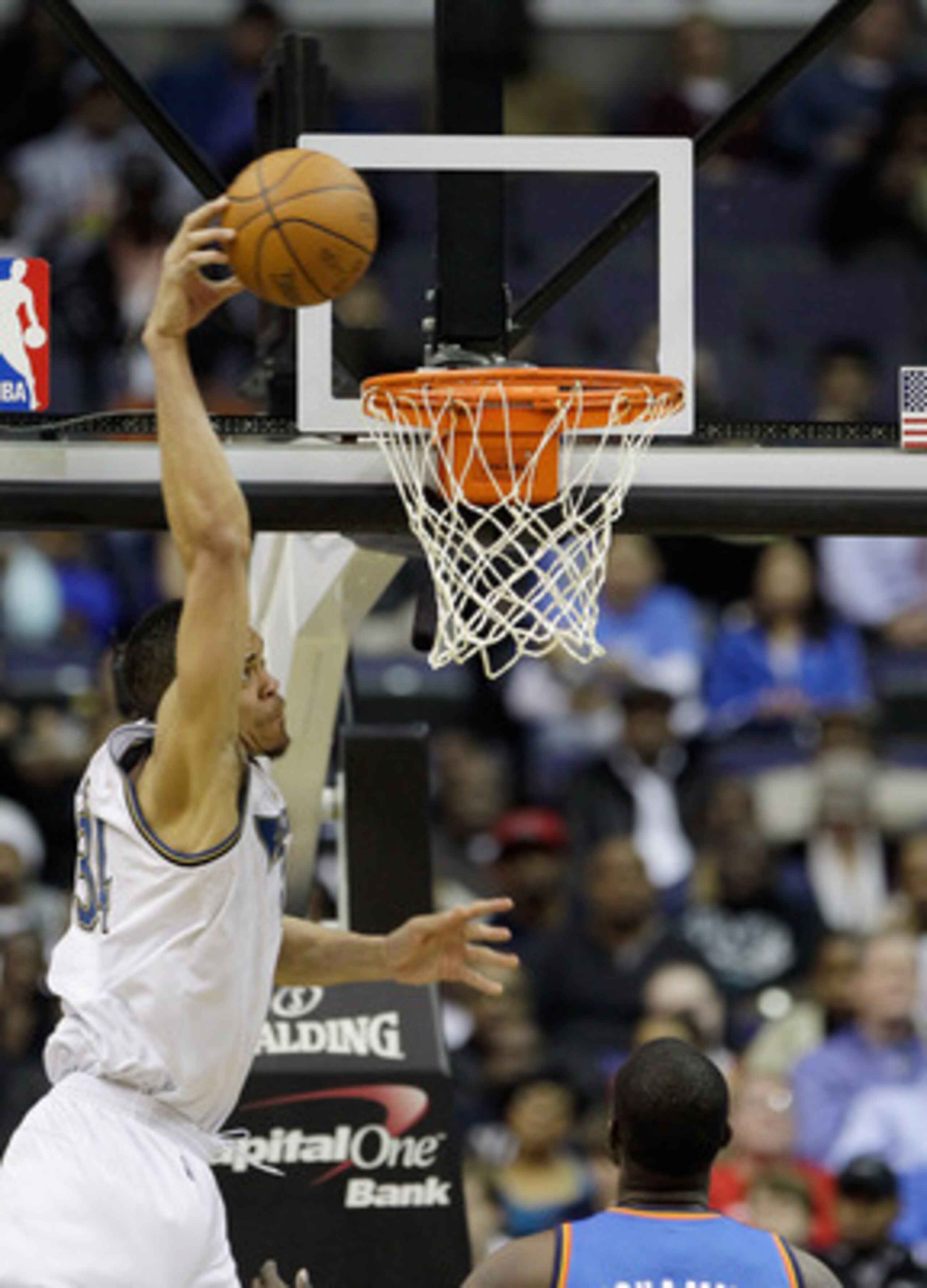 WASHINGTON, DC - MARCH 14: JaVale McGee #34 of the Washington Wizards dunks against the Oklahoma City Thunder during the first half at the Verizon Center on March 14, 2011 in Washington, DC. NOTE TO USER: User expressly acknowledges and agrees that, by do WASHINGTON, DC - MARCH 14: JaVale McGee #34 of the Washington Wizards dunks against the Oklahoma City Thunder during the first half at the Verizon Center on March 14, 2011 in Washington, DC. NOTE TO USER: User expressly acknowledges and agrees that, by do