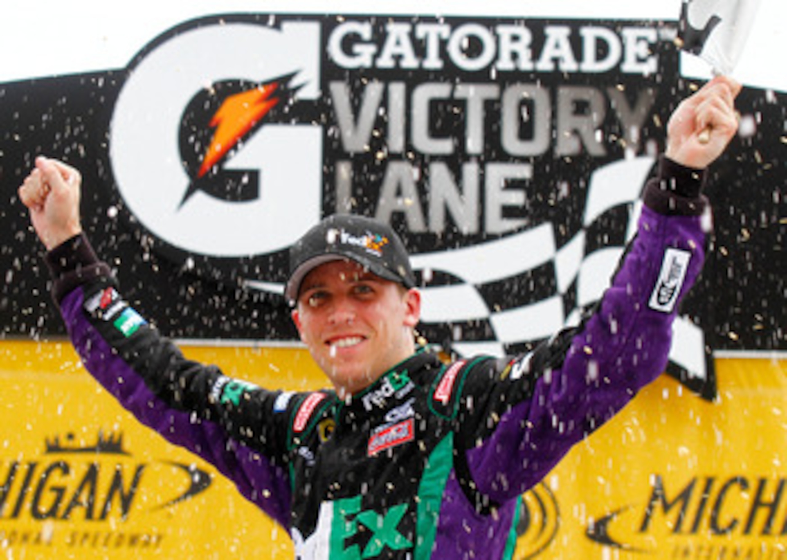 BROOKLYN, MI - JUNE 13: Denny Hamlin, driver of the #11 FedEx Ground Toyota, celebrates in Victory Lane after winning the NASCAR Sprint Cup Series Heluva Good! Sour Cream Dips 400 at Michigan International Speedway on June 13, 2010 in Brooklyn, Michigan. BROOKLYN, MI - JUNE 13: Denny Hamlin, driver of the #11 FedEx Ground Toyota, celebrates in Victory Lane after winning the NASCAR Sprint Cup Series Heluva Good! Sour Cream Dips 400 at Michigan International Speedway on June 13, 2010 in Brooklyn, Michigan.