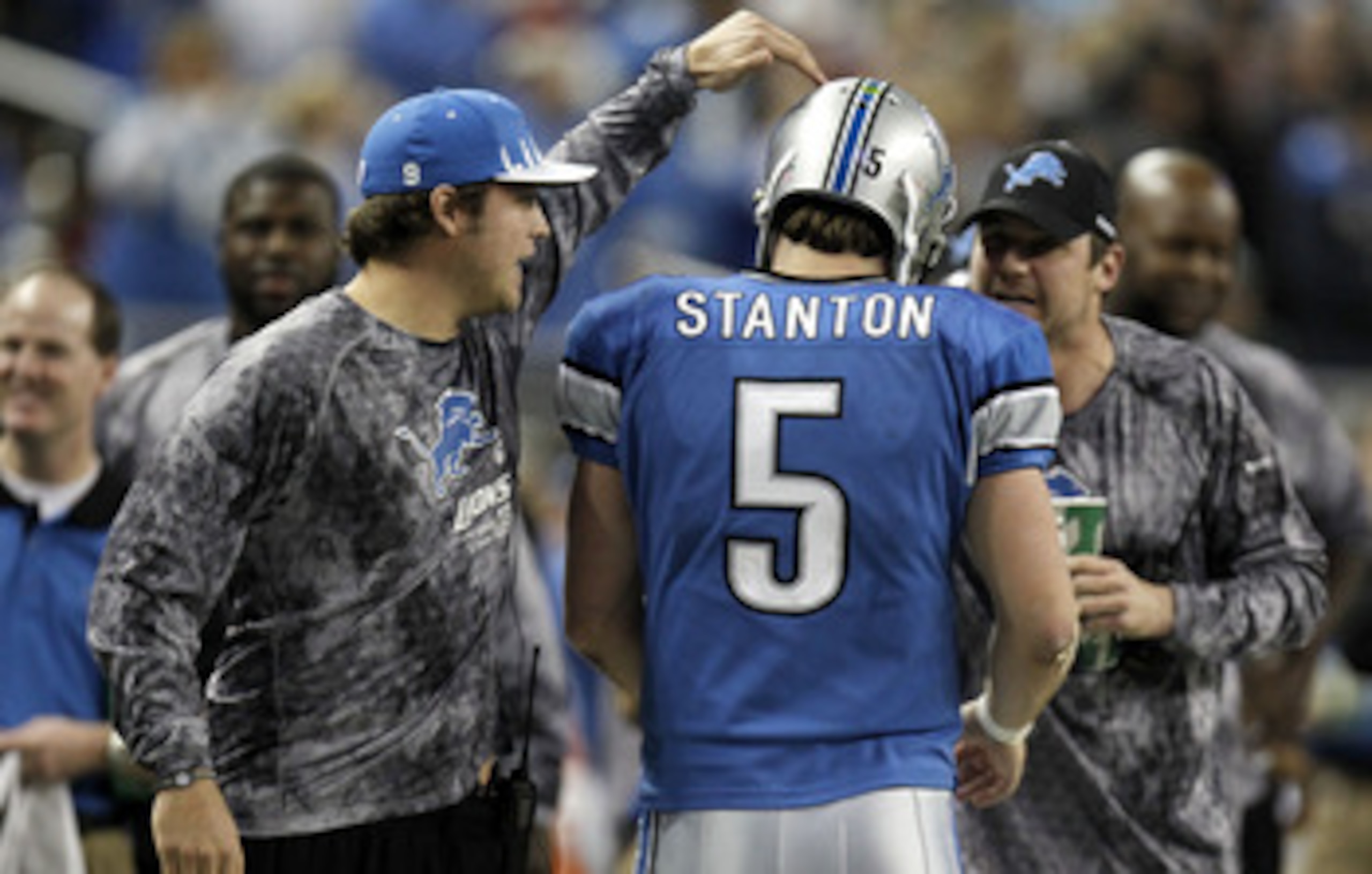 DETROIT, MI - DECEMBER 12:  Drew Stanton #5 of the Detroit Lions is congragulated by Matthew Stafford #9 and Shaun Hill #14 after a fourth quarter touchdown against the Green Bay Packers on December 12, 2010 at Ford Field in Detroit, Michigan. Detroit won
