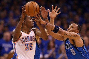 OKLAHOMA CITY, OK - MAY 23:  Kevin Durant #35 of the Oklahoma City Thunder moves the ball as Shawn Marion #0 of the Dallas Mavericks goes after the ball in the first half in Game Four of the Western Conference Finals during the 2011 NBA Playoffs at Oklaho
