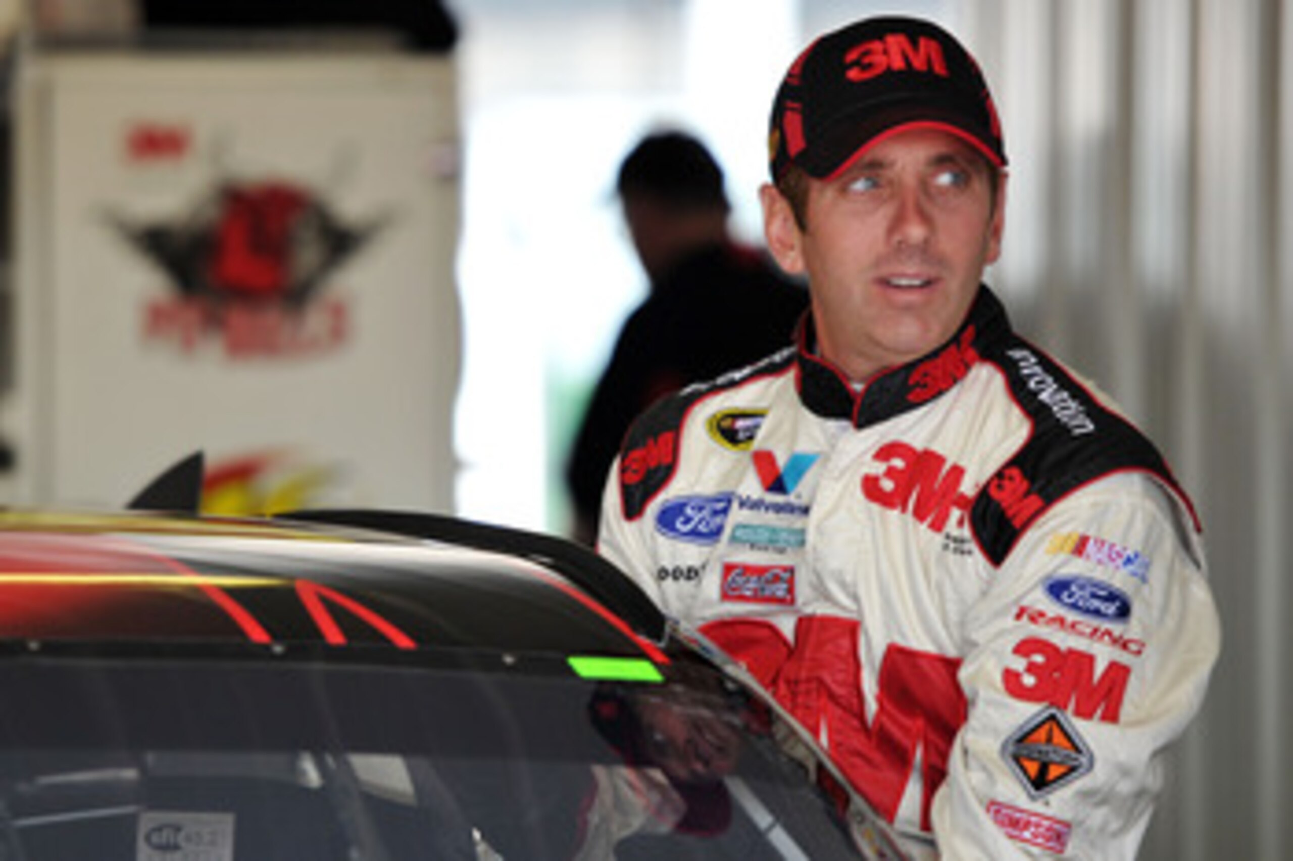 LONG POND, PA - JUNE 10: Greg Biffle, driver of the #16 3M Ford, climbs into his car in the garage area during practice for the NASCAR Sprint Cup Series 5-Hour Energy 500 at Pocono Raceway on June 10, 2011 in Long Pond, Pennsylvania. (Photo by Drew Hall LONG POND, PA - JUNE 10: Greg Biffle, driver of the #16 3M Ford, climbs into his car in the garage area during practice for the NASCAR Sprint Cup Series 5-Hour Energy 500 at Pocono Raceway on June 10, 2011 in Long Pond, Pennsylvania. (Photo by Drew Hall
