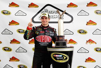 LONG POND, PA - JUNE 12:  Jeff Gordon, driver of the #24 DuPont Chevrolet, celebrates with the trophy after winning the NASCAR Sprint Cup Series 5-Hour Energy 500 at Pocono Raceway on June 12, 2011 in Long Pond, Pennsylvania.  (Photo by Geoff Burke/Getty 