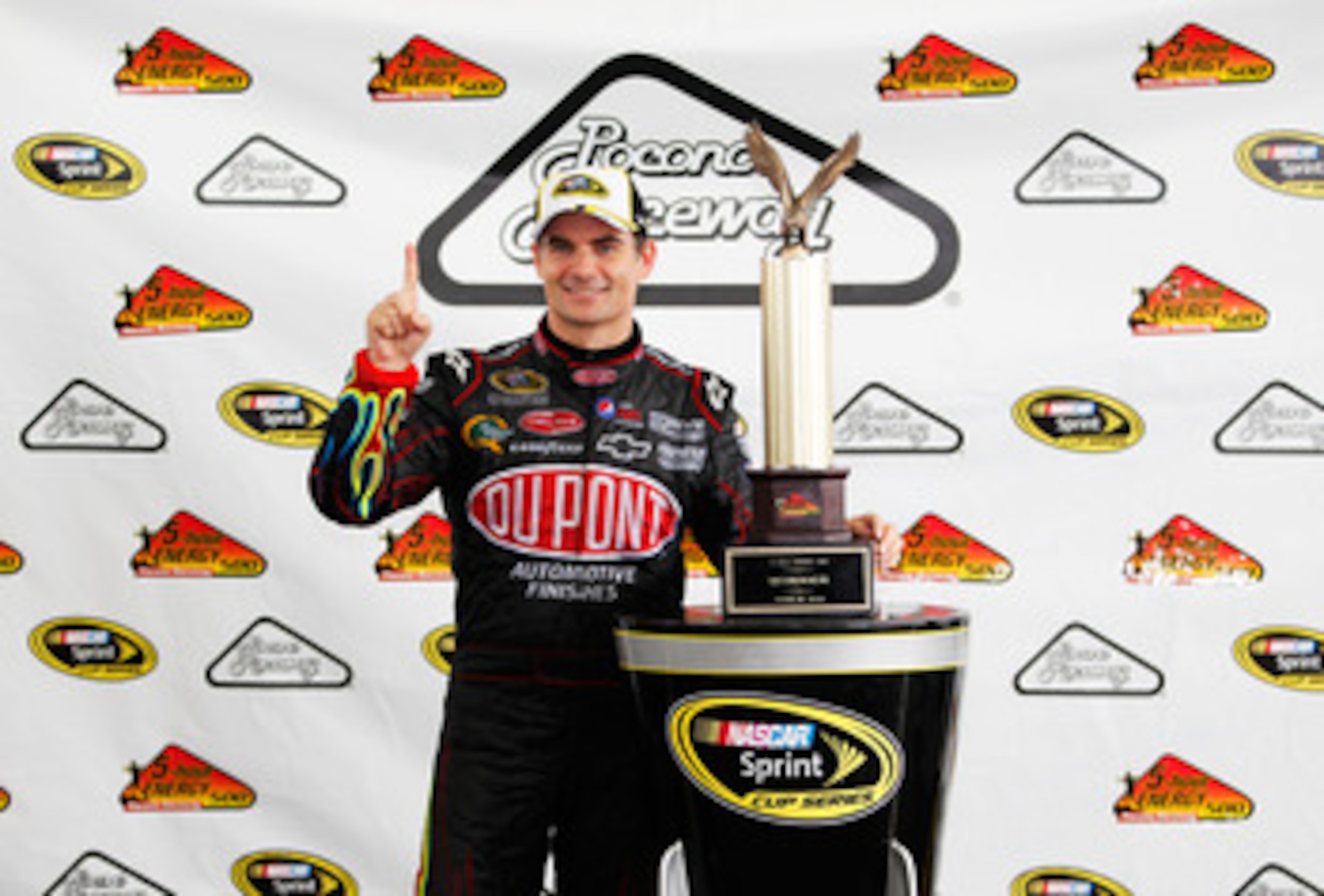 LONG POND, PA - JUNE 12: Jeff Gordon, driver of the #24 DuPont Chevrolet, celebrates with the trophy after winning the NASCAR Sprint Cup Series 5-Hour Energy 500 at Pocono Raceway on June 12, 2011 in Long Pond, Pennsylvania. (Photo by Geoff Burke/Getty LONG POND, PA - JUNE 12: Jeff Gordon, driver of the #24 DuPont Chevrolet, celebrates with the trophy after winning the NASCAR Sprint Cup Series 5-Hour Energy 500 at Pocono Raceway on June 12, 2011 in Long Pond, Pennsylvania. (Photo by Geoff Burke/Getty