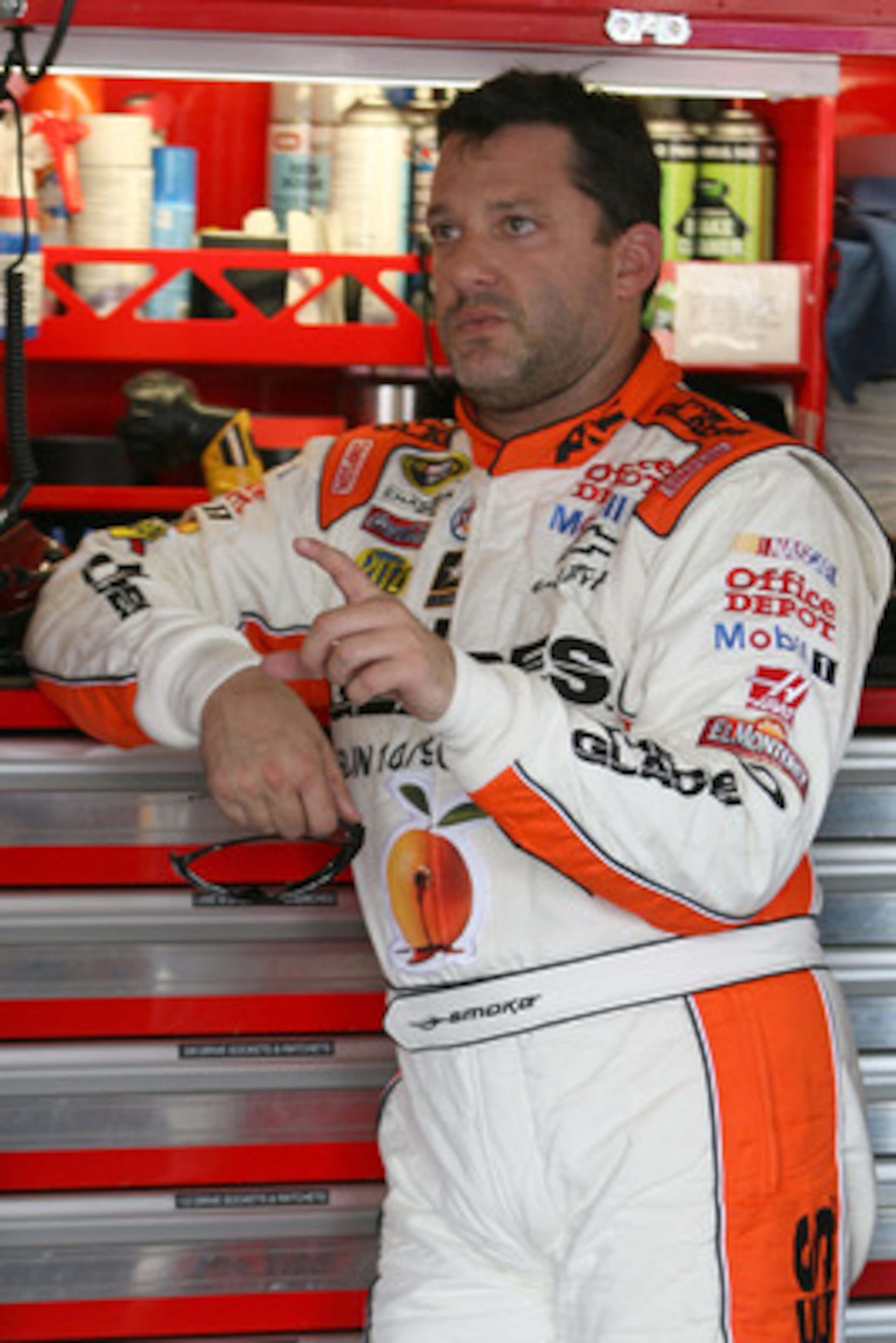 KANSAS CITY, KS - JUNE 03: Tony Stewart, driver of the #14 The Glades/Office Depot Chevrolet, stands in the garage area during practice for the NASCAR Sprint Cup Series STP 400 at Kansas Speedway on June 3, 2011 in Kansas City, Kansas. (Photo by Tim Ump KANSAS CITY, KS - JUNE 03: Tony Stewart, driver of the #14 The Glades/Office Depot Chevrolet, stands in the garage area during practice for the NASCAR Sprint Cup Series STP 400 at Kansas Speedway on June 3, 2011 in Kansas City, Kansas. (Photo by Tim Ump
