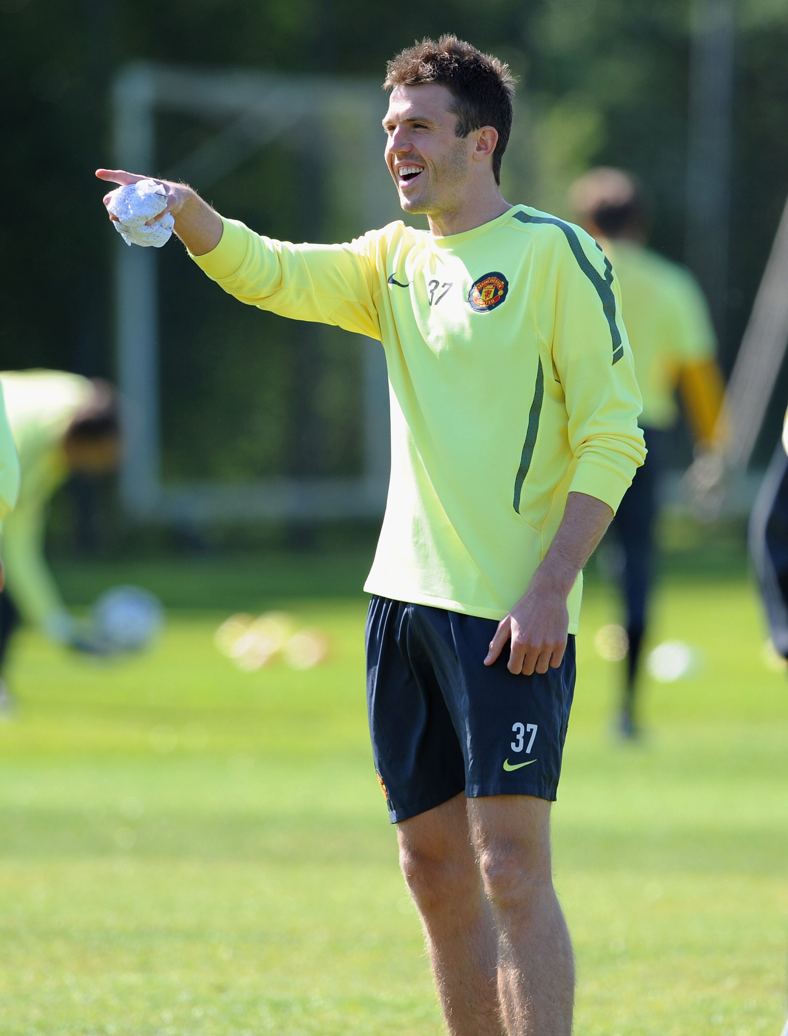 MANCHESTER, ENGLAND - MAY 03:  Michael Carrick gestures during a training session ahead of their UEFA Champions League semi final second leg match against Schalke 04 at the Carrington Training Ground on May 3, 2011 in Manchester, England.  (Photo by Micha