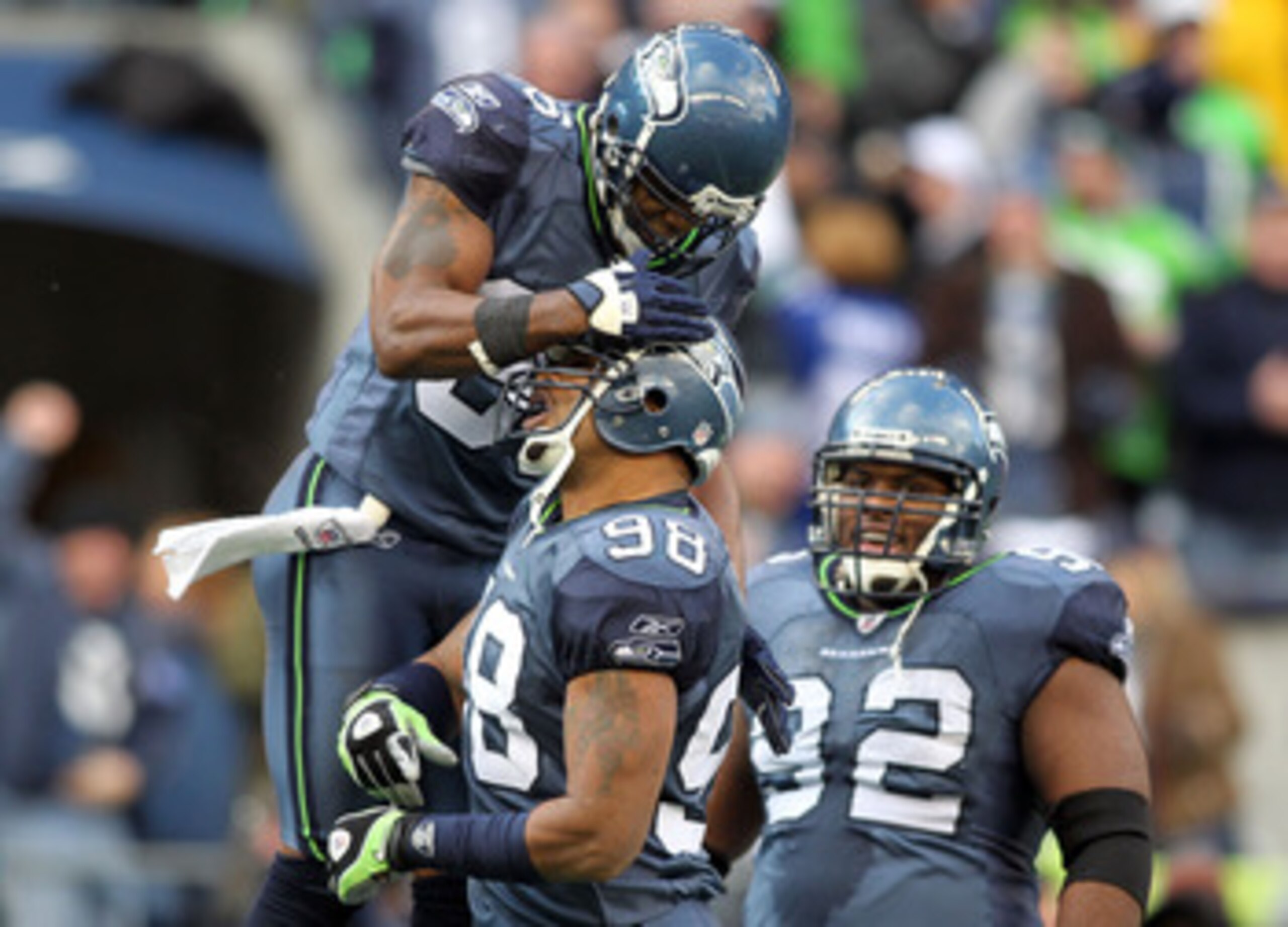 SEATTLE, WA - JANUARY 08: Raheem Brock #98 of the Seattle Seahawks celebrates with teammates after his sack of quarterback Drew Brees #9 of the New Orleans Saints in the second quarter during the 2011 NFC wild-card playoff game at Qwest Field on January SEATTLE, WA - JANUARY 08: Raheem Brock #98 of the Seattle Seahawks celebrates with teammates after his sack of quarterback Drew Brees #9 of the New Orleans Saints in the second quarter during the 2011 NFC wild-card playoff game at Qwest Field on January