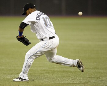 TORONTO, CANADA - MAY 10: Edwin Encarnacion #10 of the Toronto Blue Jays misses a grounder during MLB action against the Boston Red Sox at the Rogers Centre May 10, 2011 in Toronto, Ontario, Canada. (Photo by Abelimages/Getty Images)