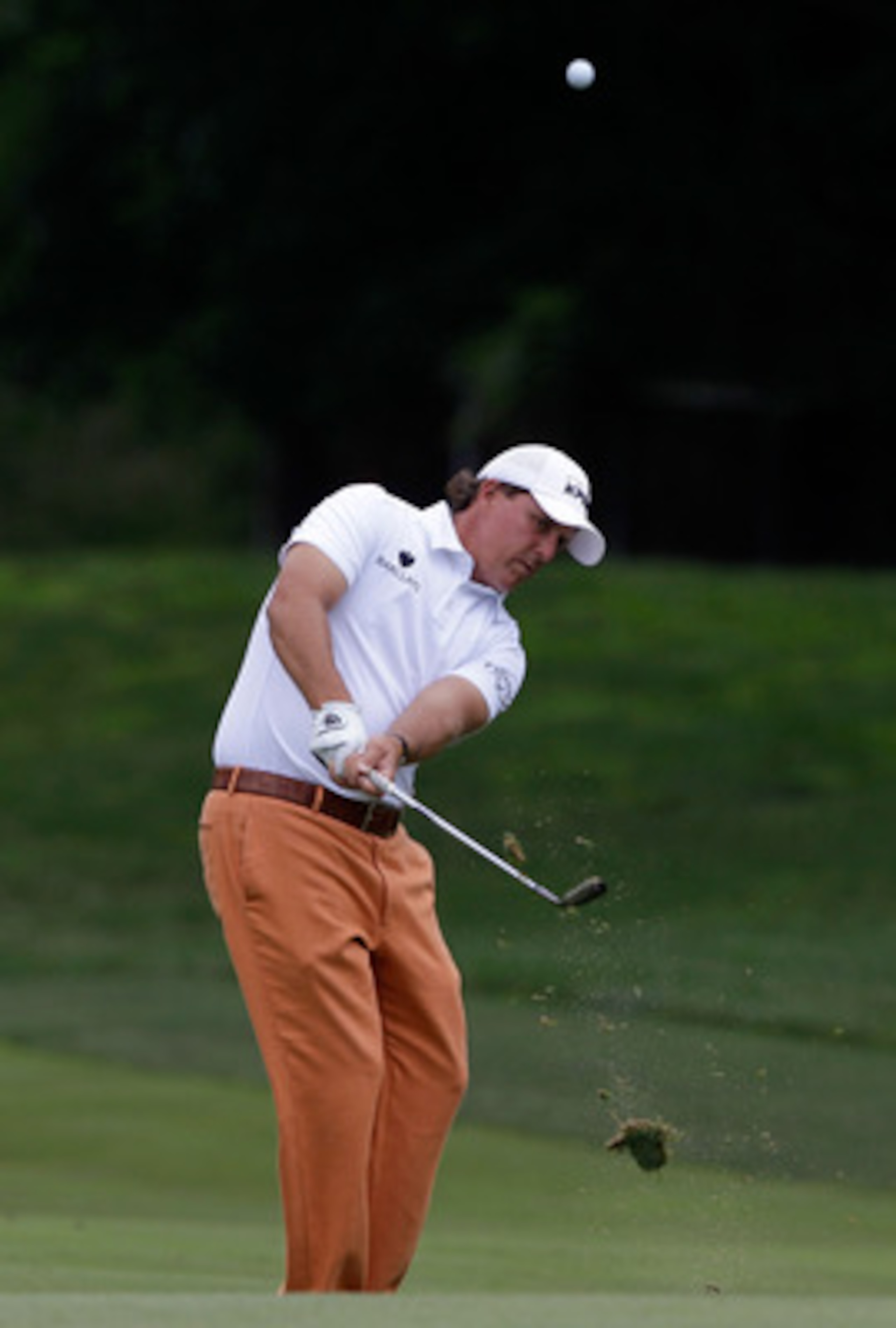 BETHESDA, MD - JUNE 14:  Phil Mickelson hits a shot during a practice round prior to the start of the 111th U.S. Open at Congressional Country Club on June 14, 2011 in Bethesda, Maryland.  (Photo by Rob Carr/Getty Images)