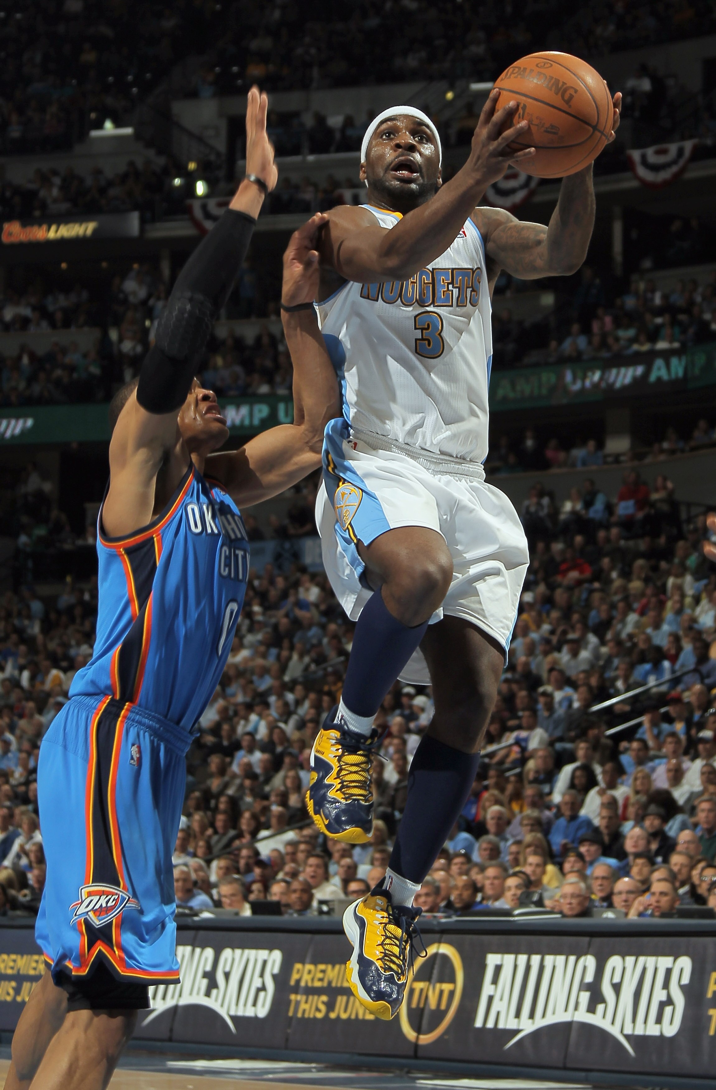 DENVER, CO - APRIL 25:  Ty Lawson #3 of the Denver Nuggets takes a shot against Russell Westbrook #0 of the Oklahoma City Thunder in Game Four of the Western Conference Quarterfinals in the 2011 NBA Playoffs on April 24, 2011 at the Pepsi Center in Denver