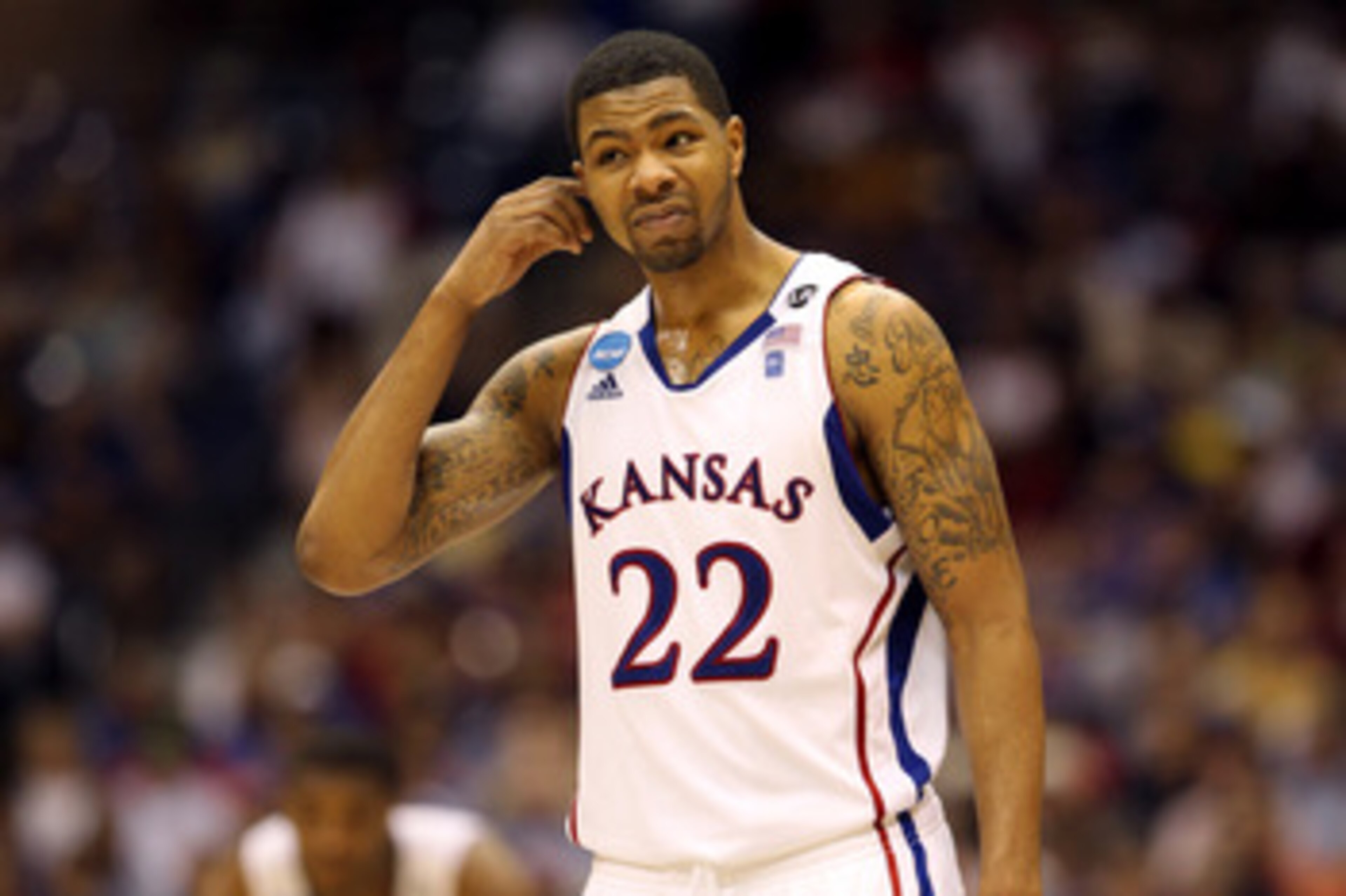 SAN ANTONIO, TX - MARCH 25:  Marcus Morris #22 of the Kansas Jayhawks reacts during the southwest regional of the 2011 NCAA men's basketball tournament against the Richmond Spiders at the Alamodome on March 25, 2011 in San Antonio, Texas. Kansas defeated 