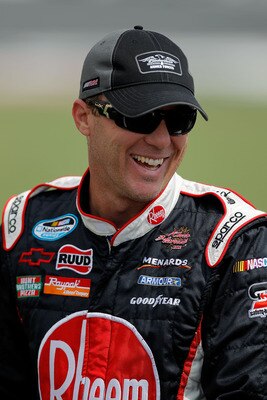 CHARLOTTE, NC - MAY 28:  Kevin Harvick, driver of the #33 Rheem Tankless Water Heaters Chevrolet, stands on the grid during qualifying for the NASCAR Nationwide Series Top Gear 300 at Charlotte Motor Speedway on May 28, 2011 in Charlotte, North Carolina. 