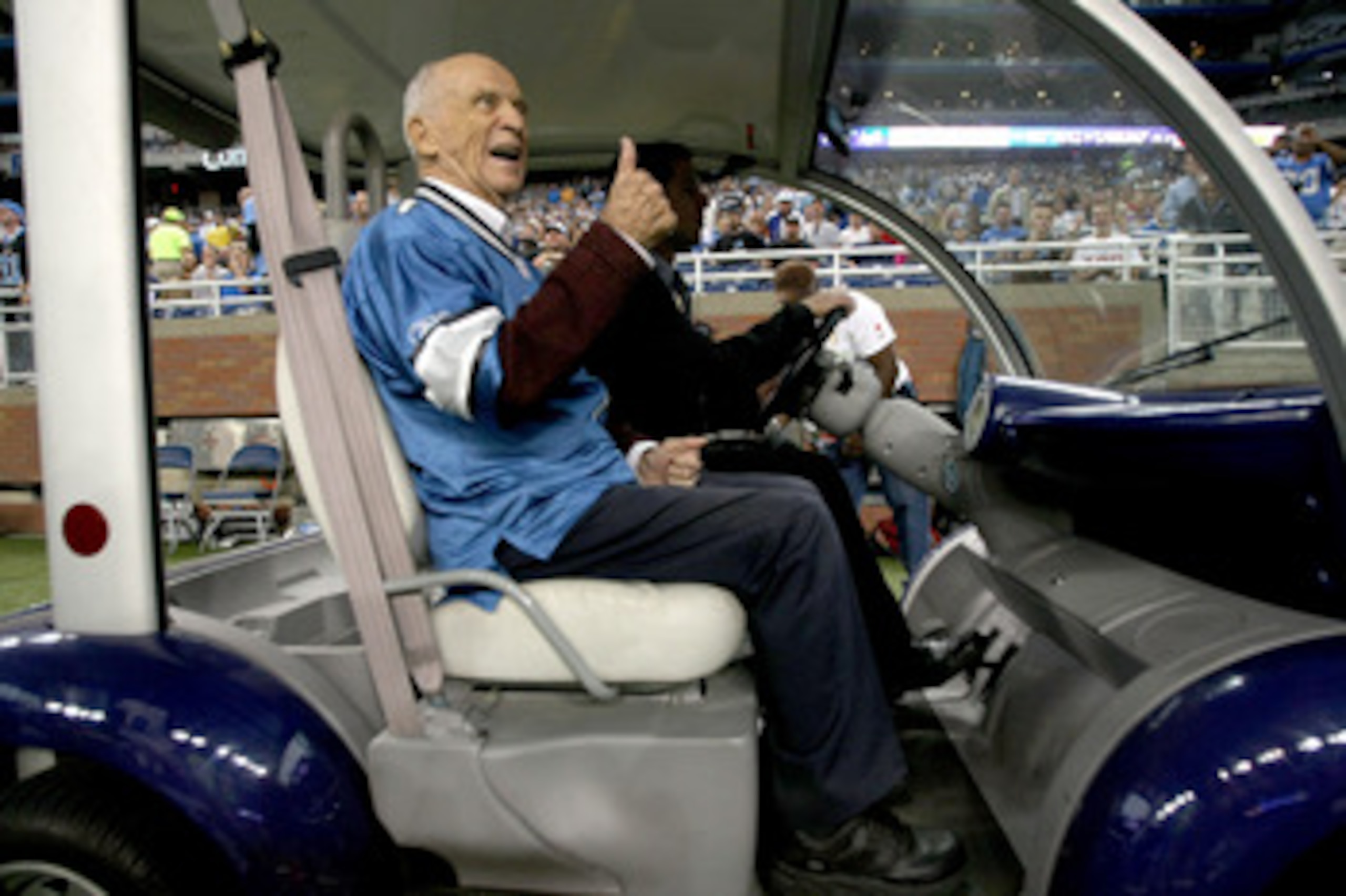 DETROIT - SEPTEMBER 20:  Detroit Tigers broadcast legend Ernie Harwell rides off the field after performing the coin toss for the game between the Detroit Lions and the Minnesota Vikings at Ford Field on September 20, 2009 in Detroit, Michigan. The Viking