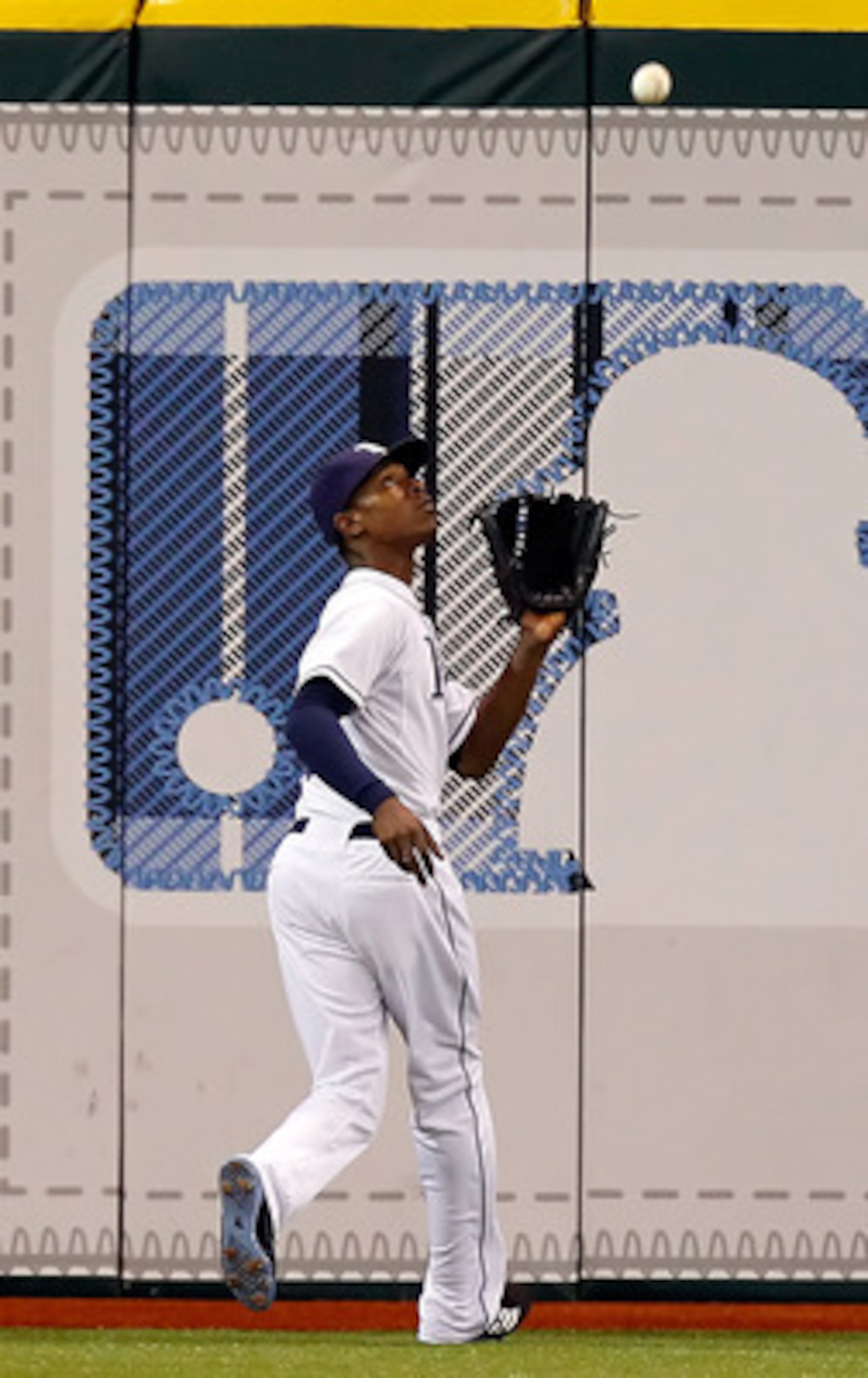 ST. PETERSBURG, FL - JUNE 15:  Outfielder B.J. Upton #2 of the Tampa Bay Rays catches a fly ball against the Boston Red Sox during the game at Tropicana Field on June 15, 2011 in St. Petersburg, Florida.  (Photo by J. Meric/Getty Images)